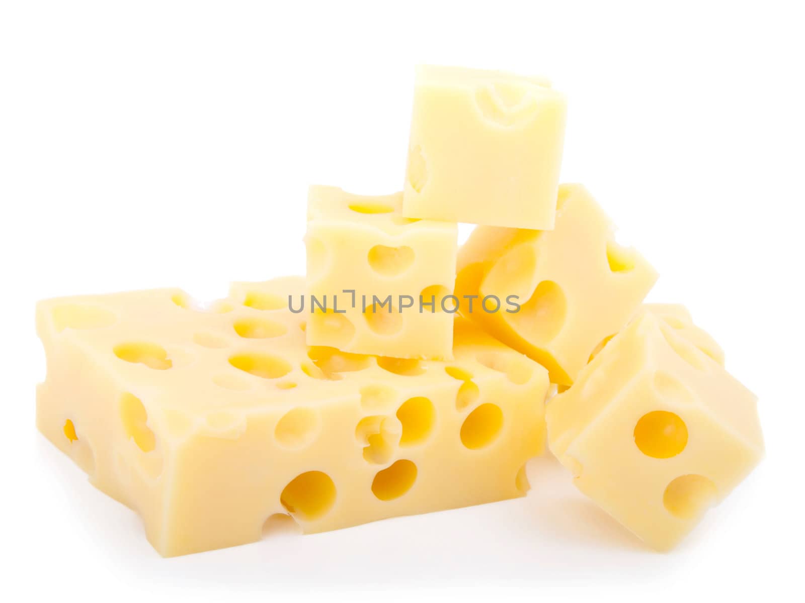 pieces of swiss cheese isolated on white background by motorolka