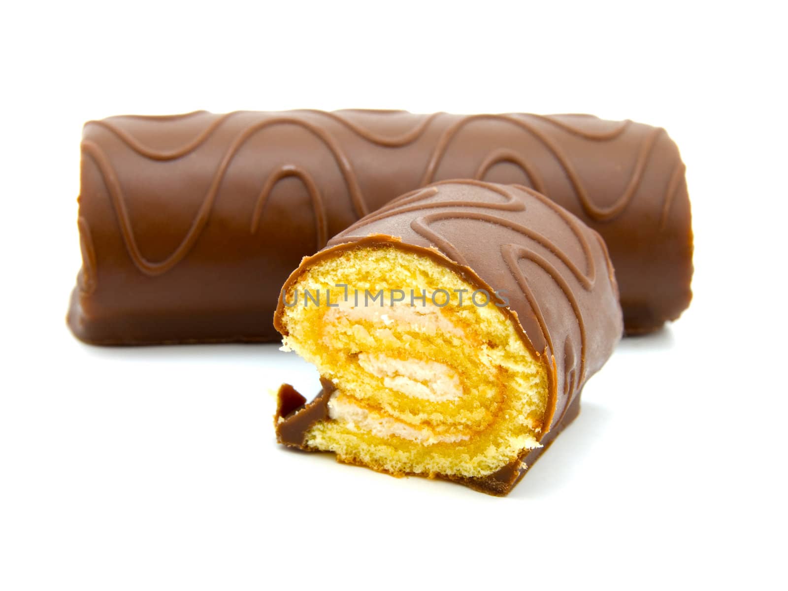 two chocolate roll with cream on a white background