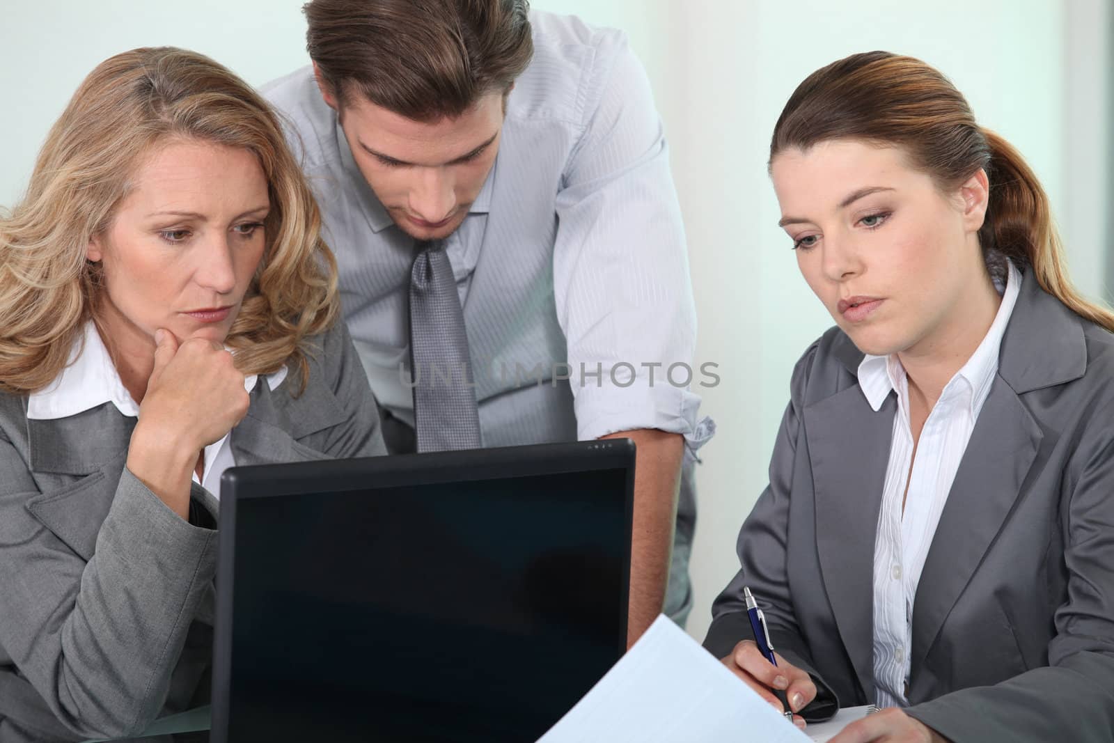 Executives with laptop computer