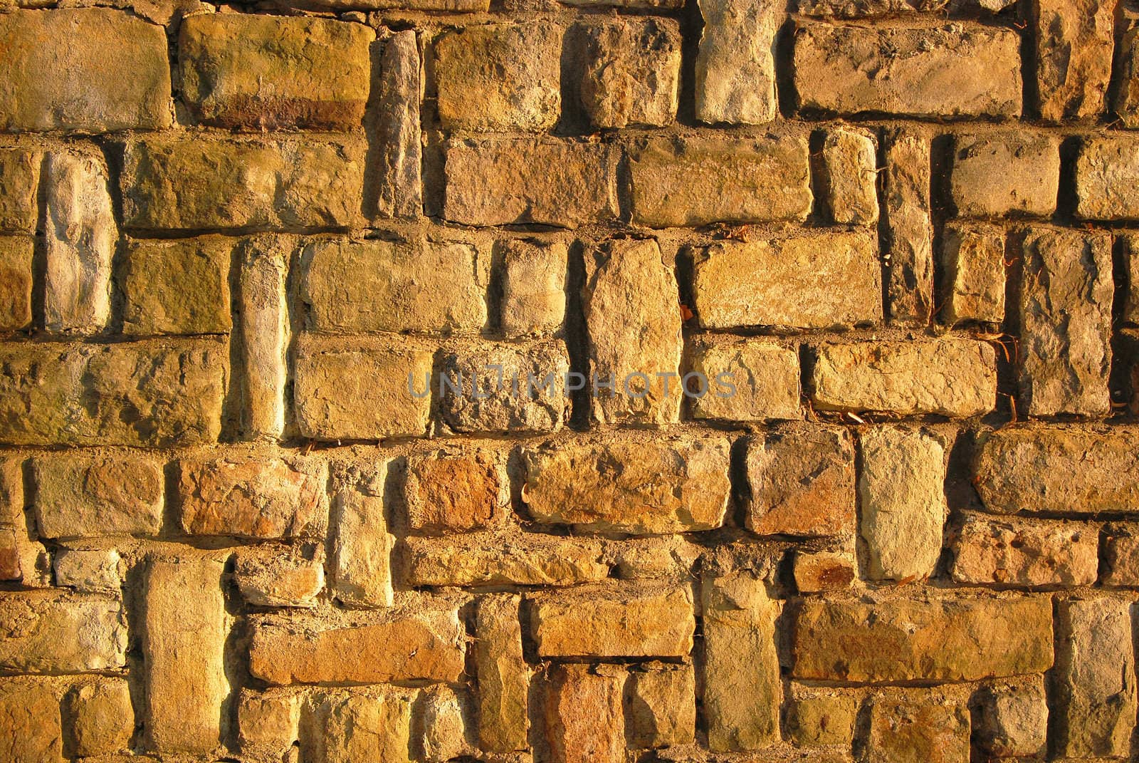 Sandstone yellow brown house wall as background