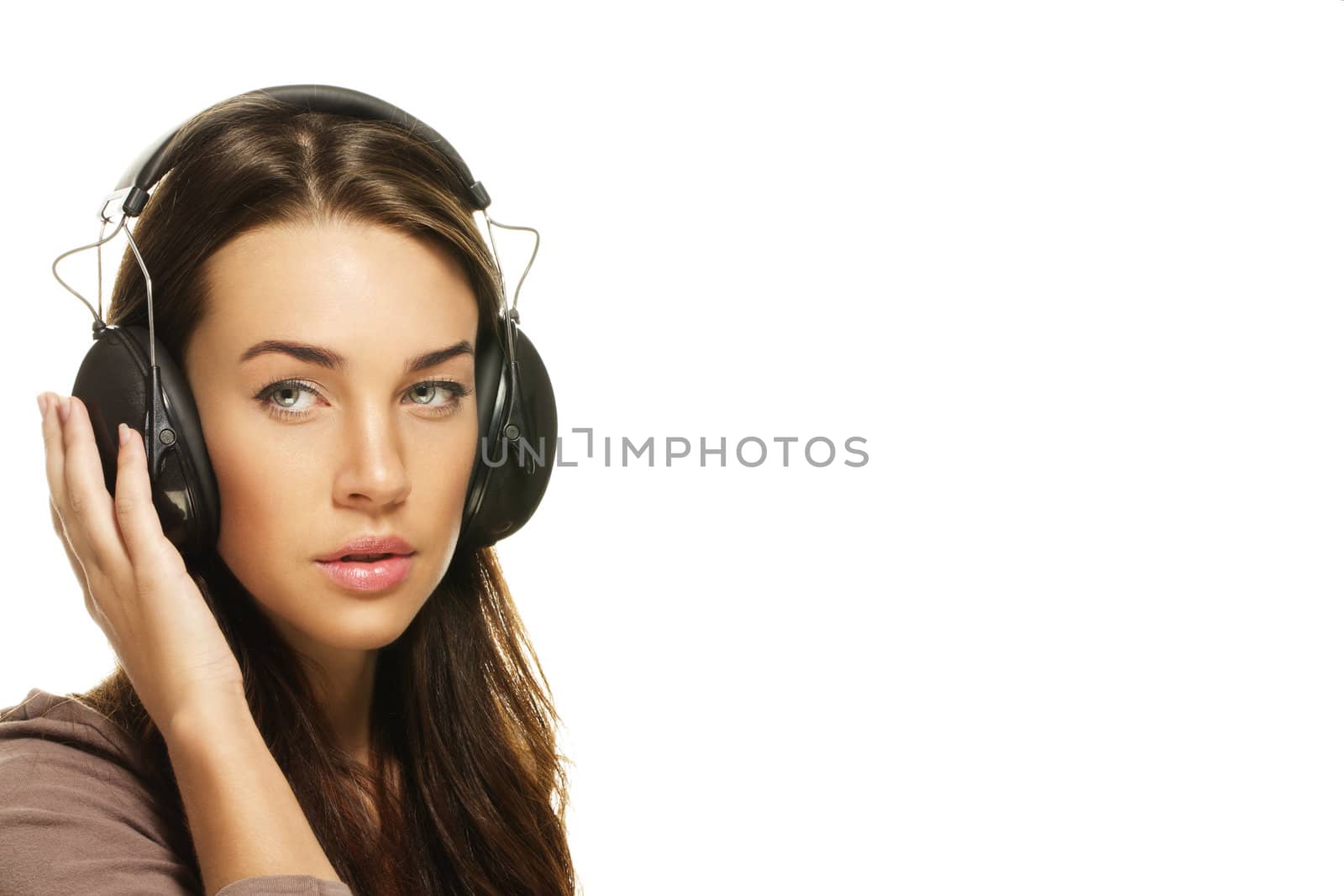 beautiful woman listening to music on white background