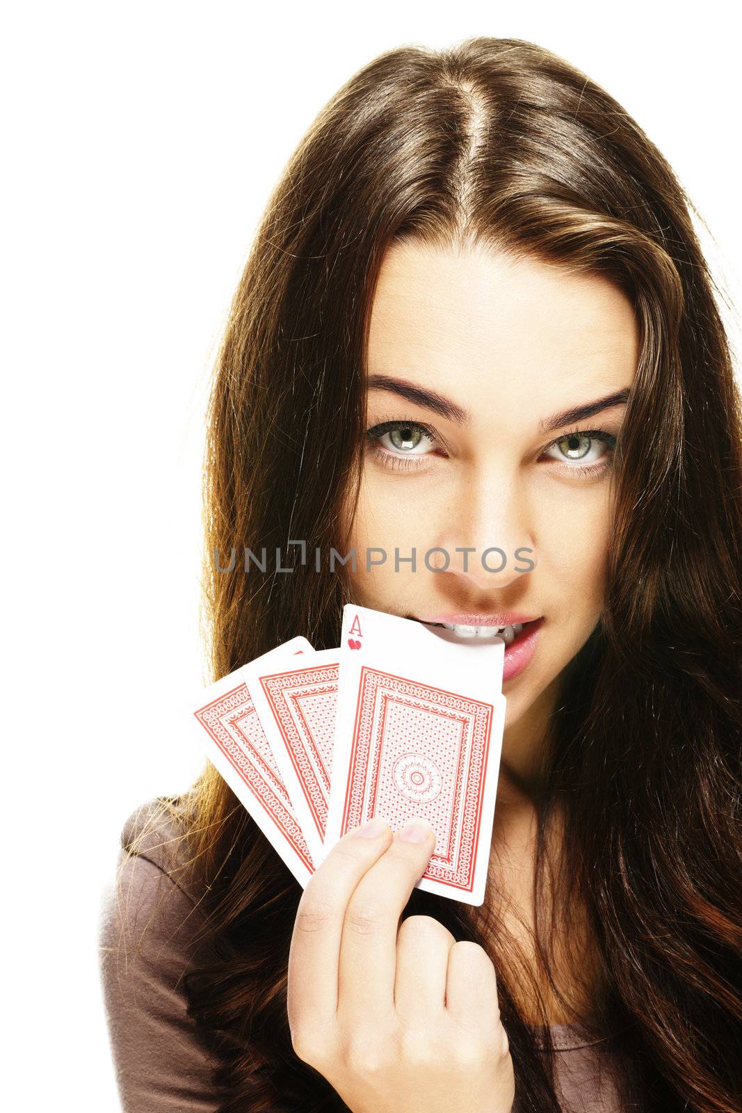 beautiful woman bites in a poker card on white background