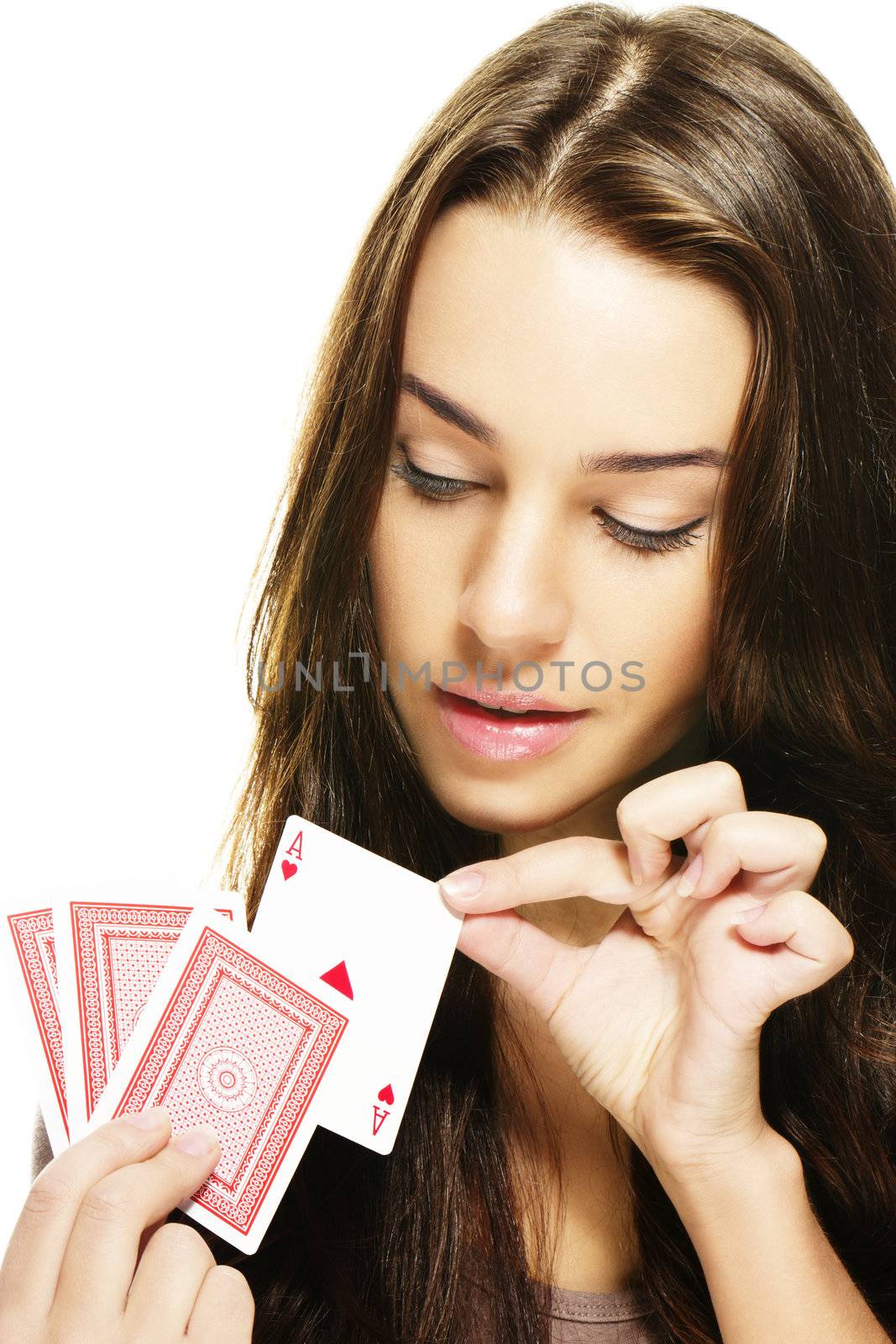 beautiful woman picks a poker card on white background