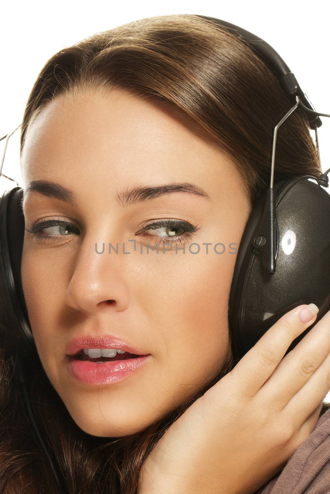 closeup of a beautiful woman listening to music
