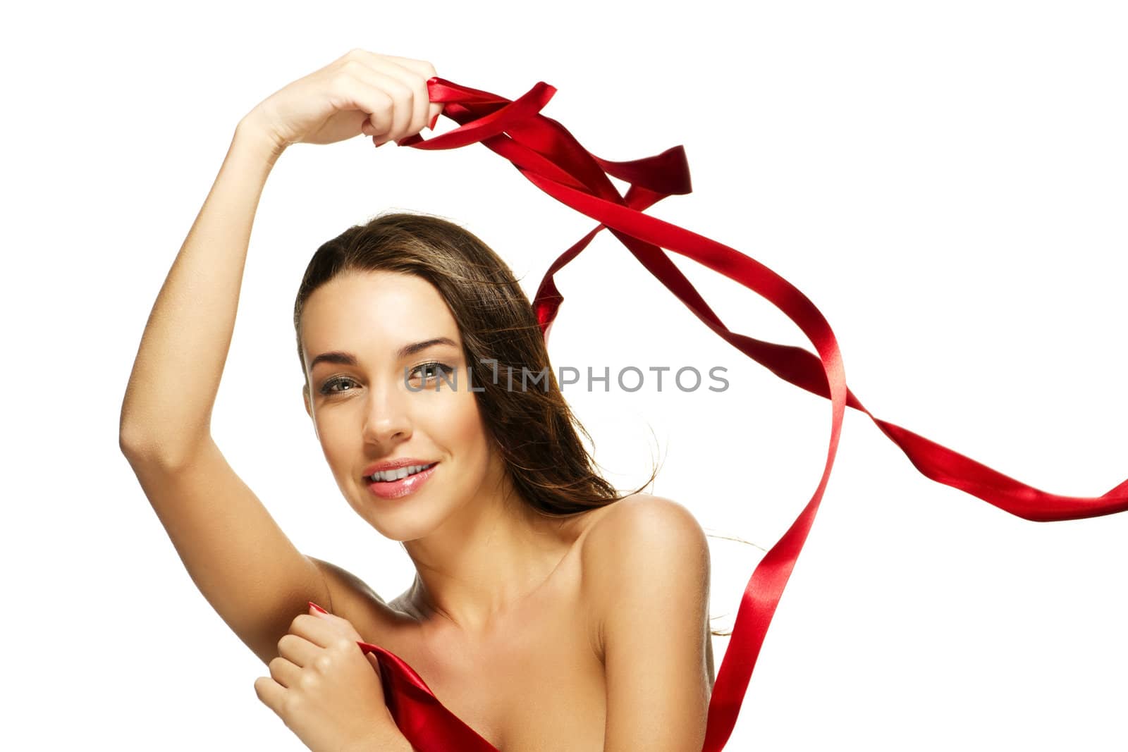 gorgeous woman playing with a red ribbon on white background