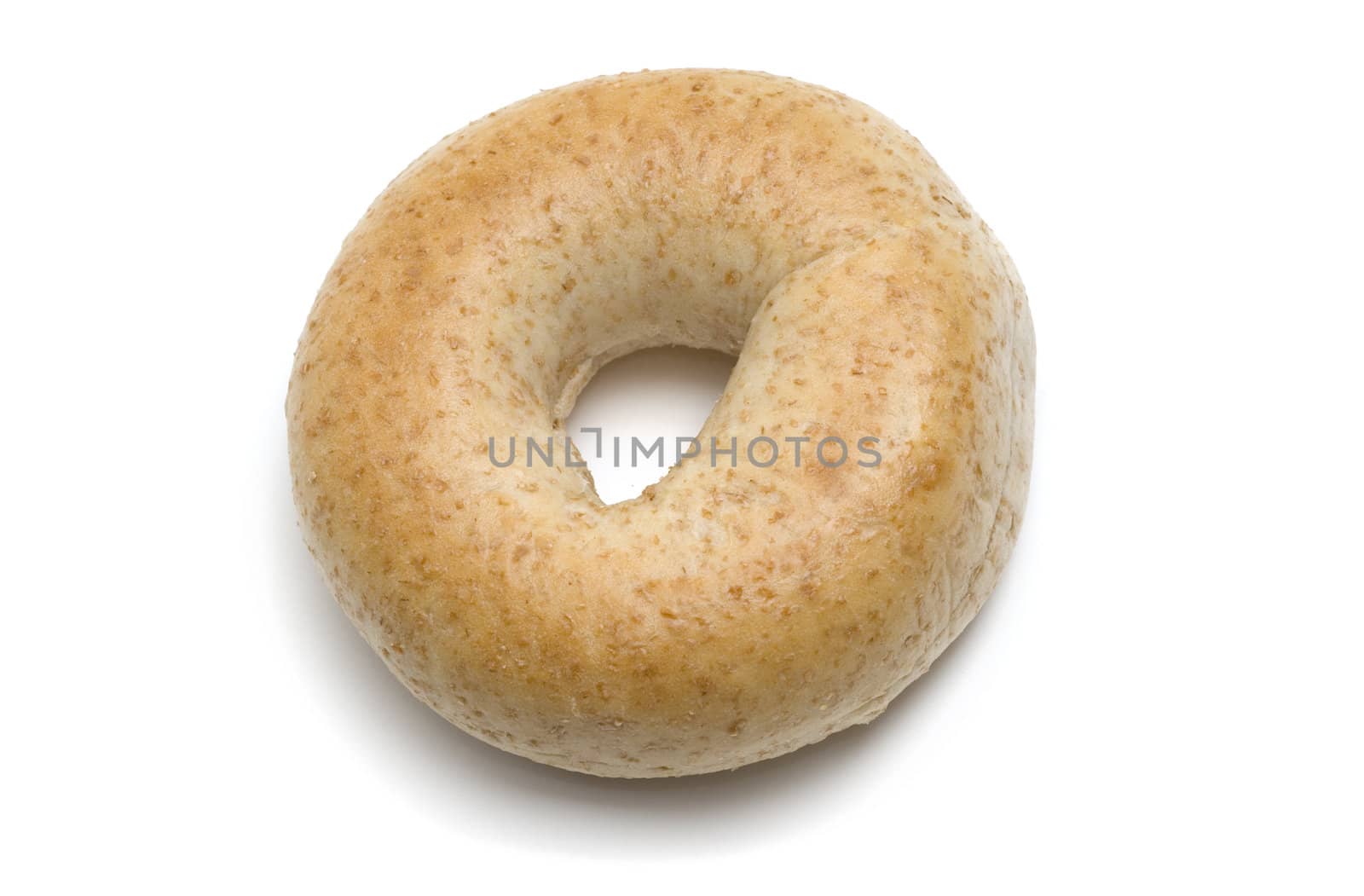Single whole wheat bagel isolated on white