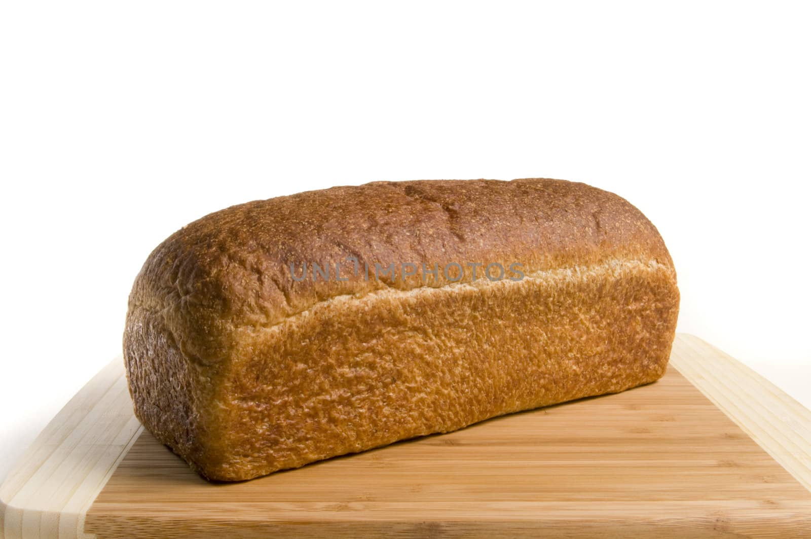 Freshly baked whole wheat bread on a cutting board