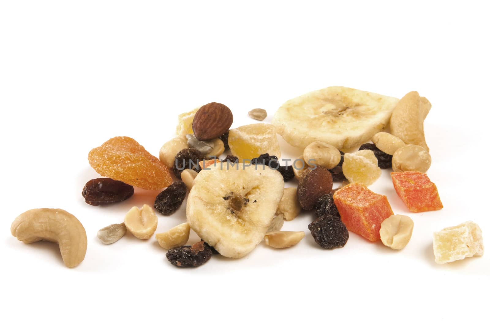 Focus on dried fruit and nuts on white background