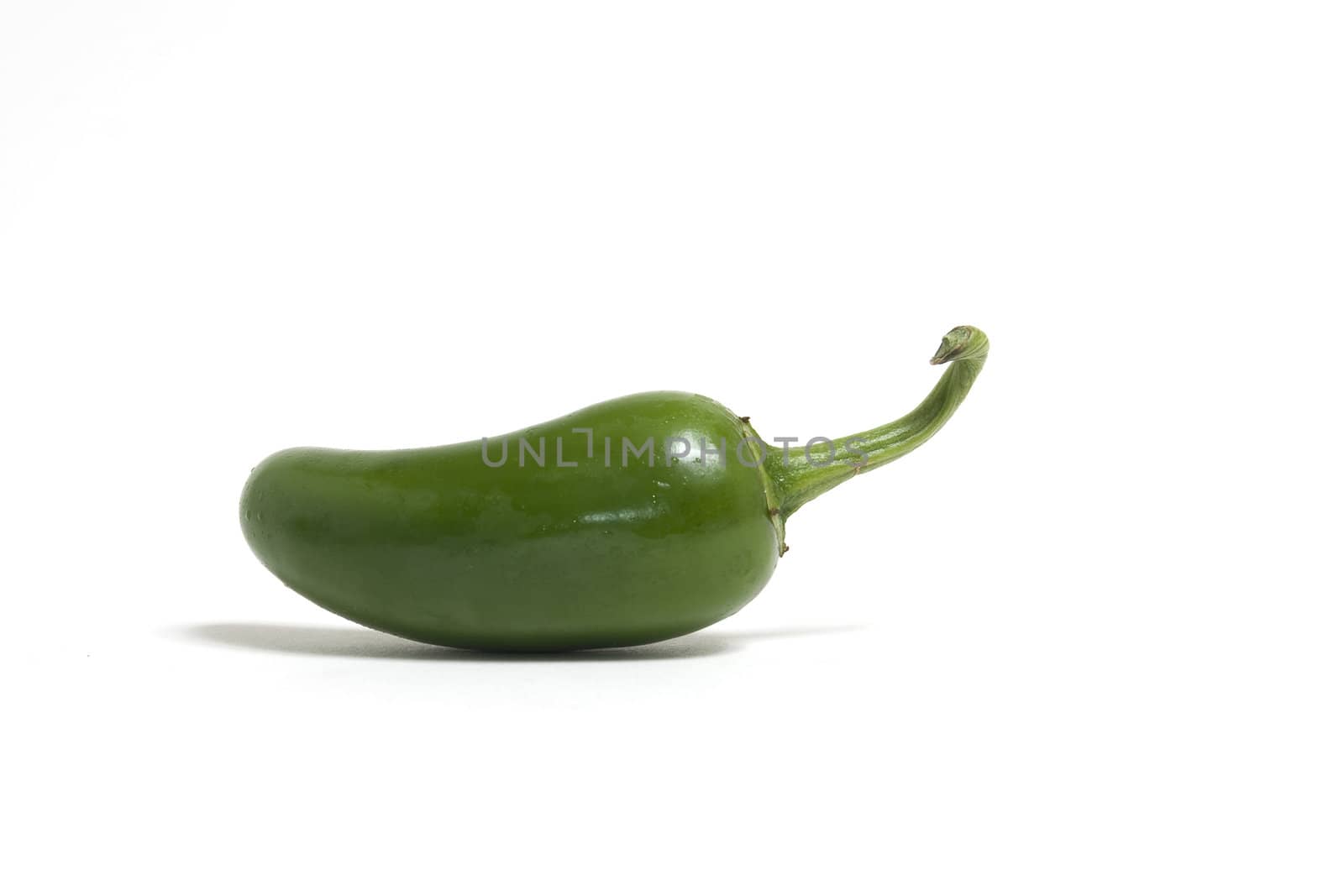 Hot green jalapeno peppers on white background