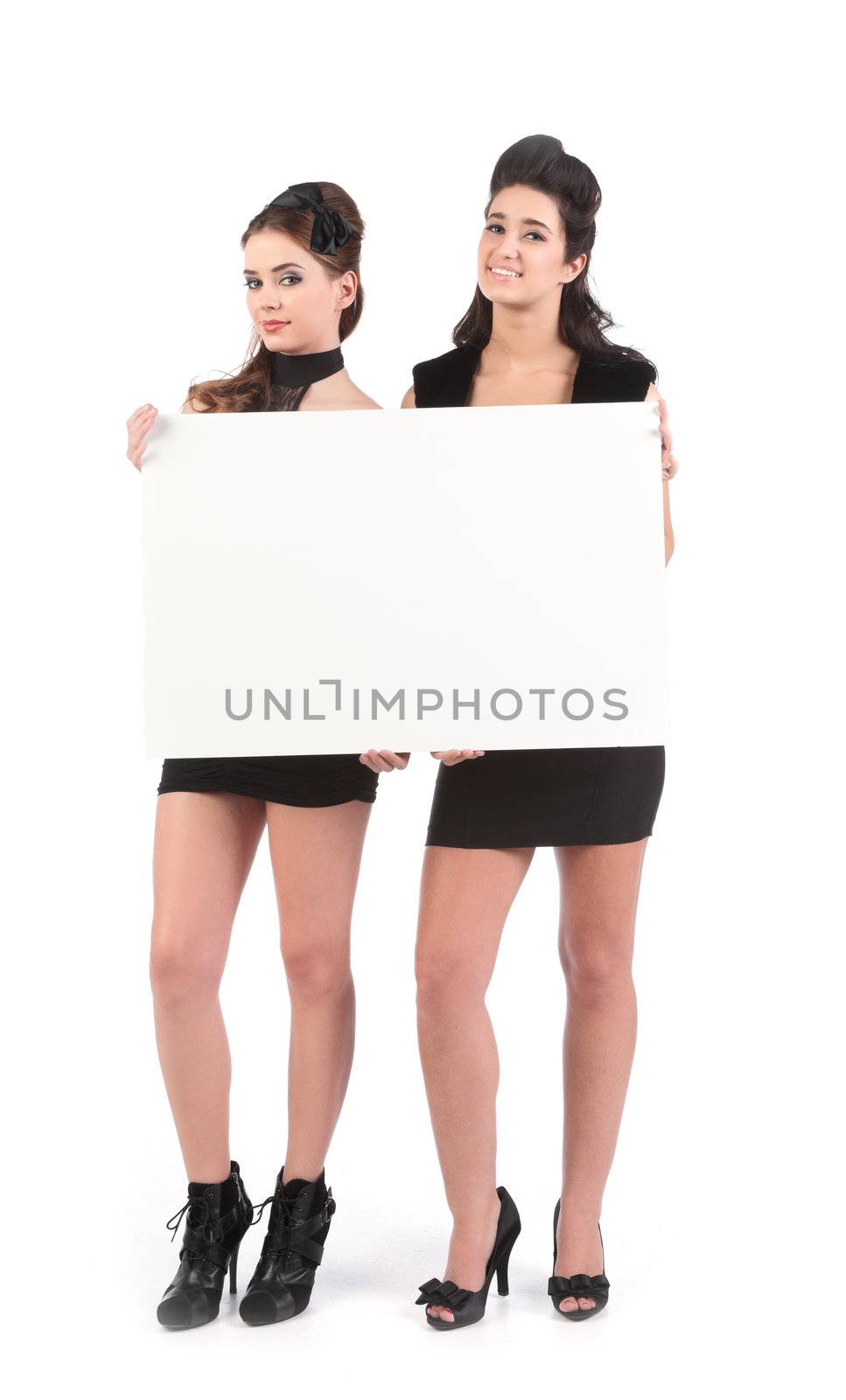 two beautiful young women models dressed for nightclub with sign