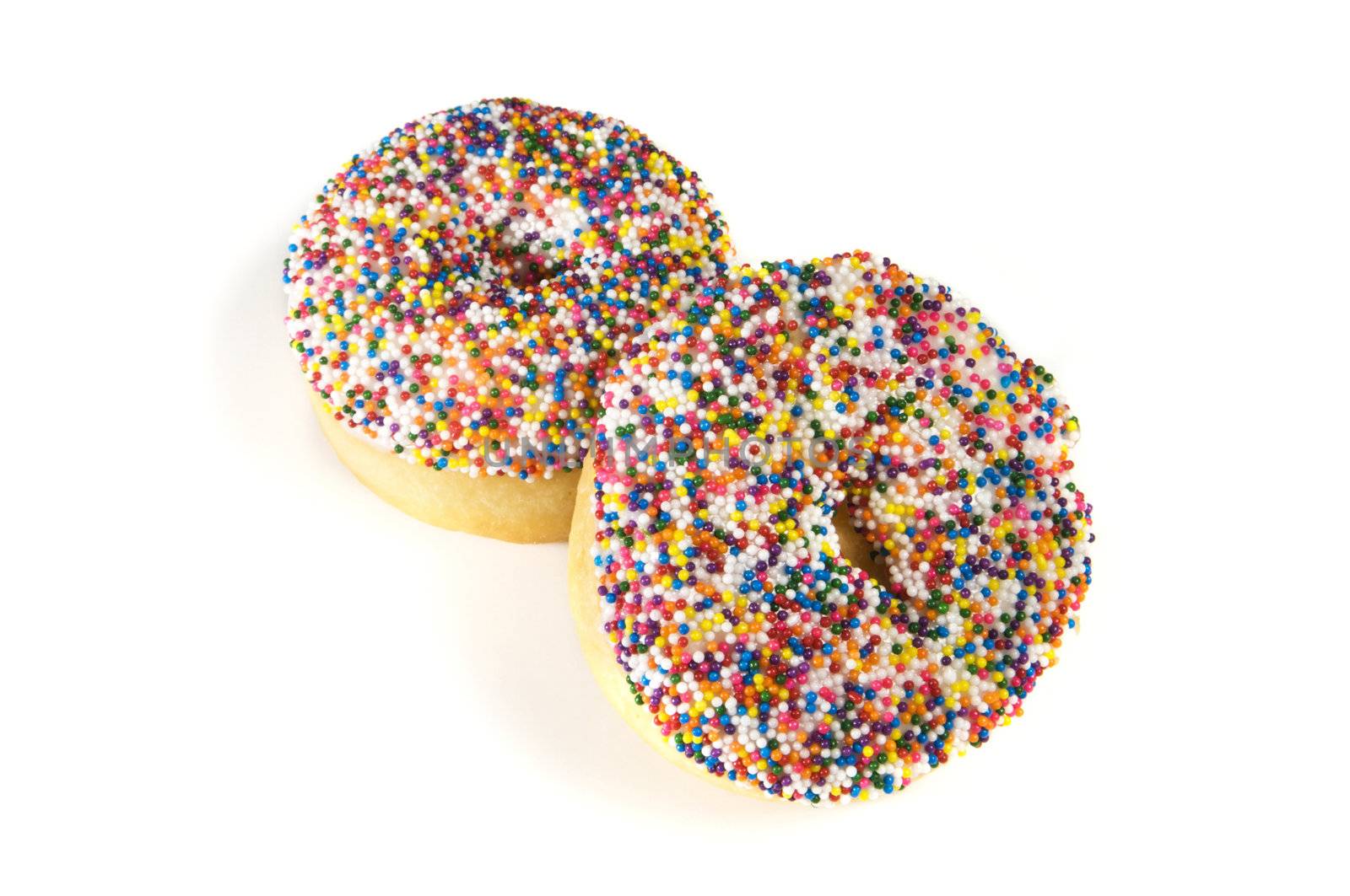 Sprinkles covered donuts isolated on a white background