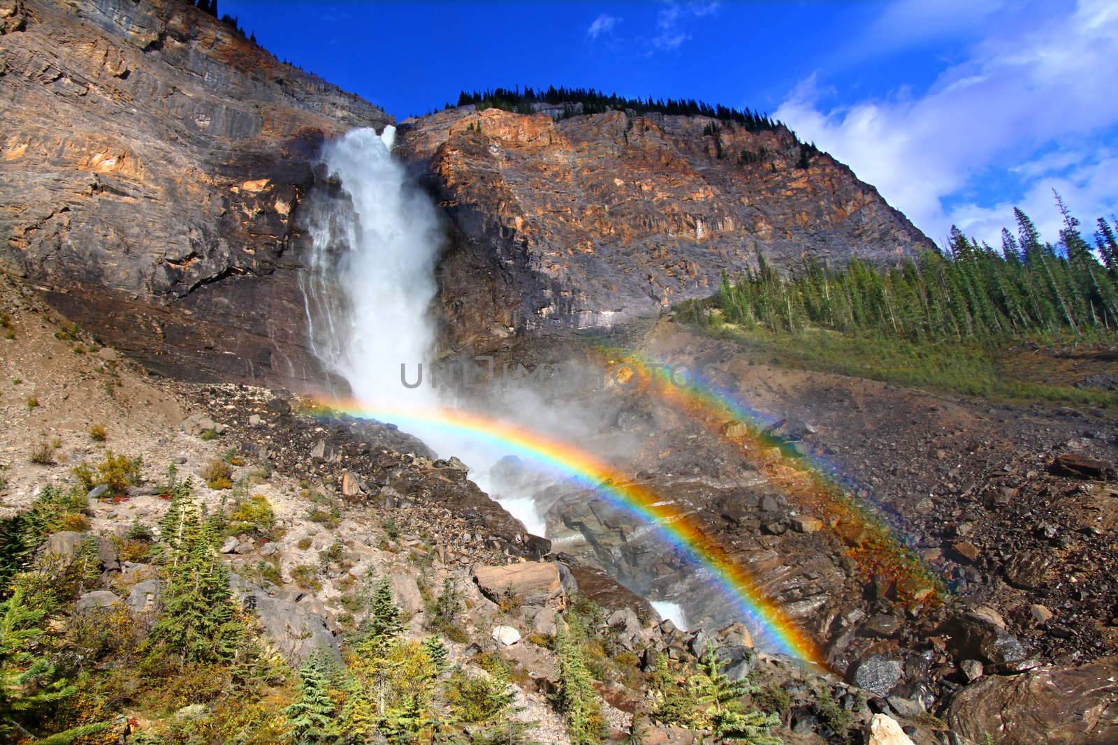 Double rainbows in the mist below Takakkaw Falls of Yoho National Park in Canada.
