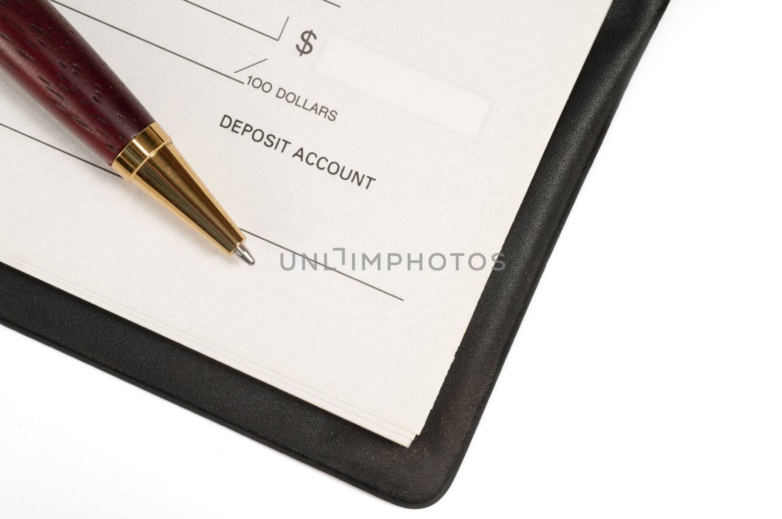Closeup on pen and open cheque book