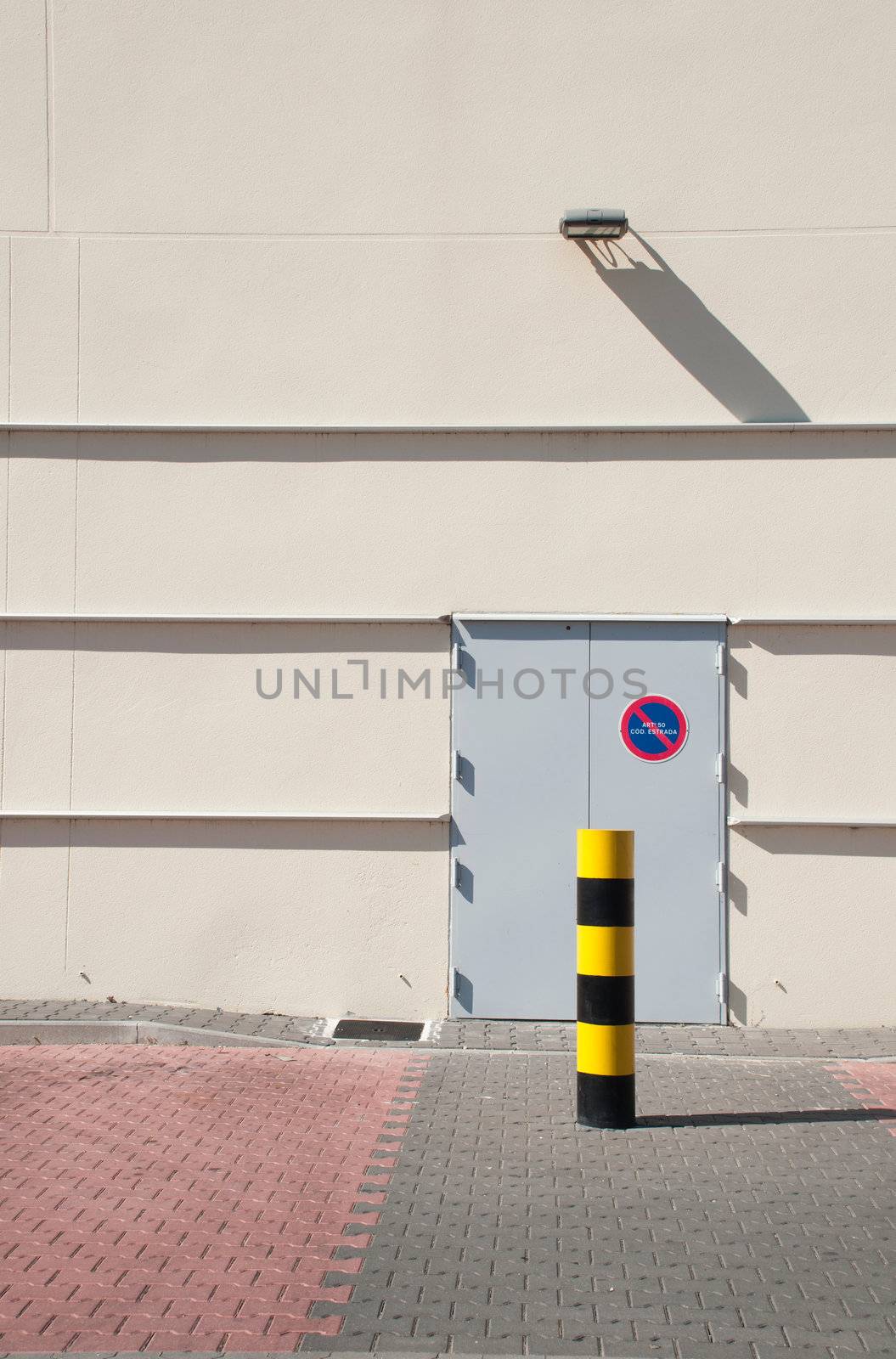 industrial warehouse with emergency exit door (parking vehicles is strictly forbidden)