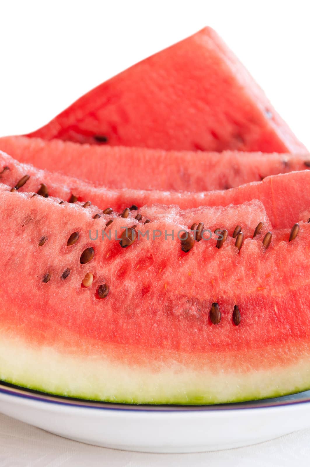 delicious watermelon slices on a plate isolated on white background (summer fruit)