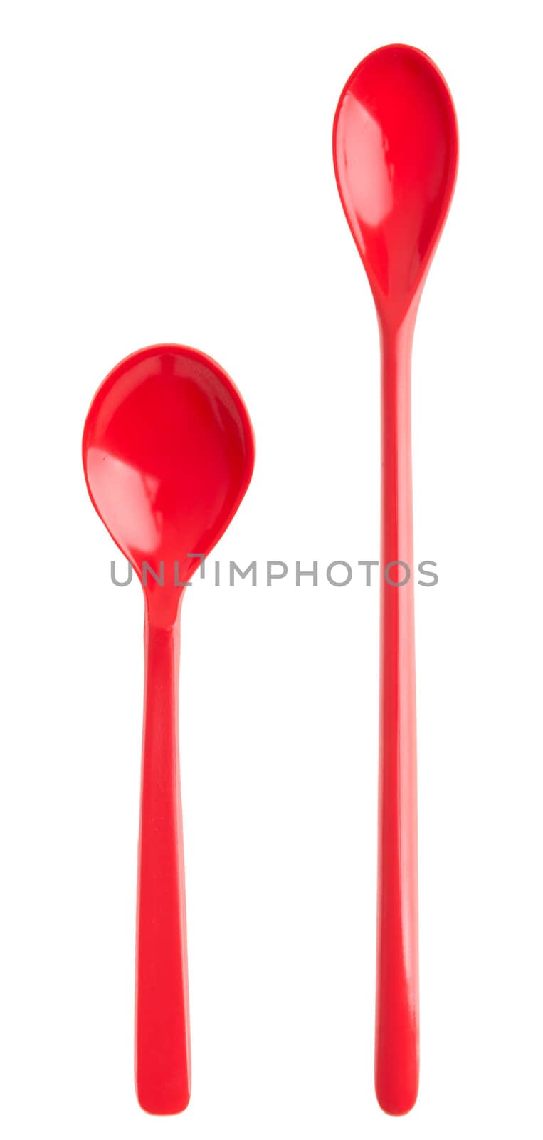 small and big porcelain spoons isolated on white background