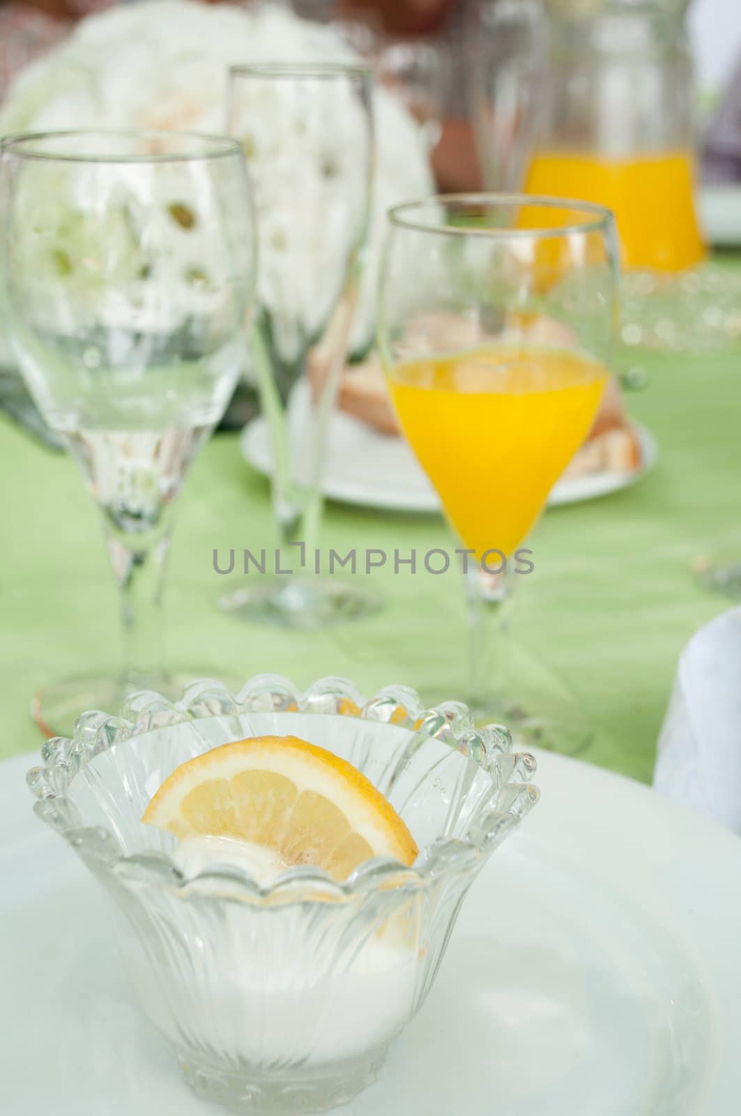 delicious lemon ice cream on a wedding table setting (it is served after the first dish in order to not mix taste between fish and meat plates)