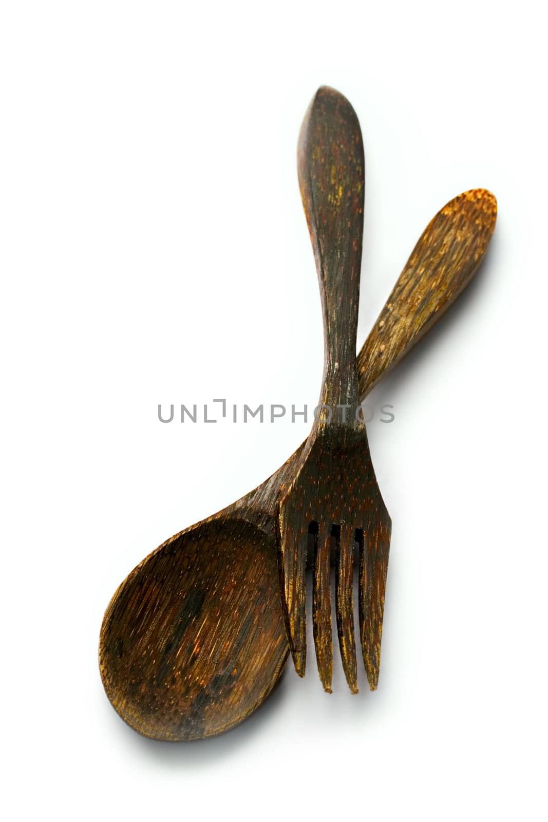 Wooden spoon and fork isolated on white by Garsya
