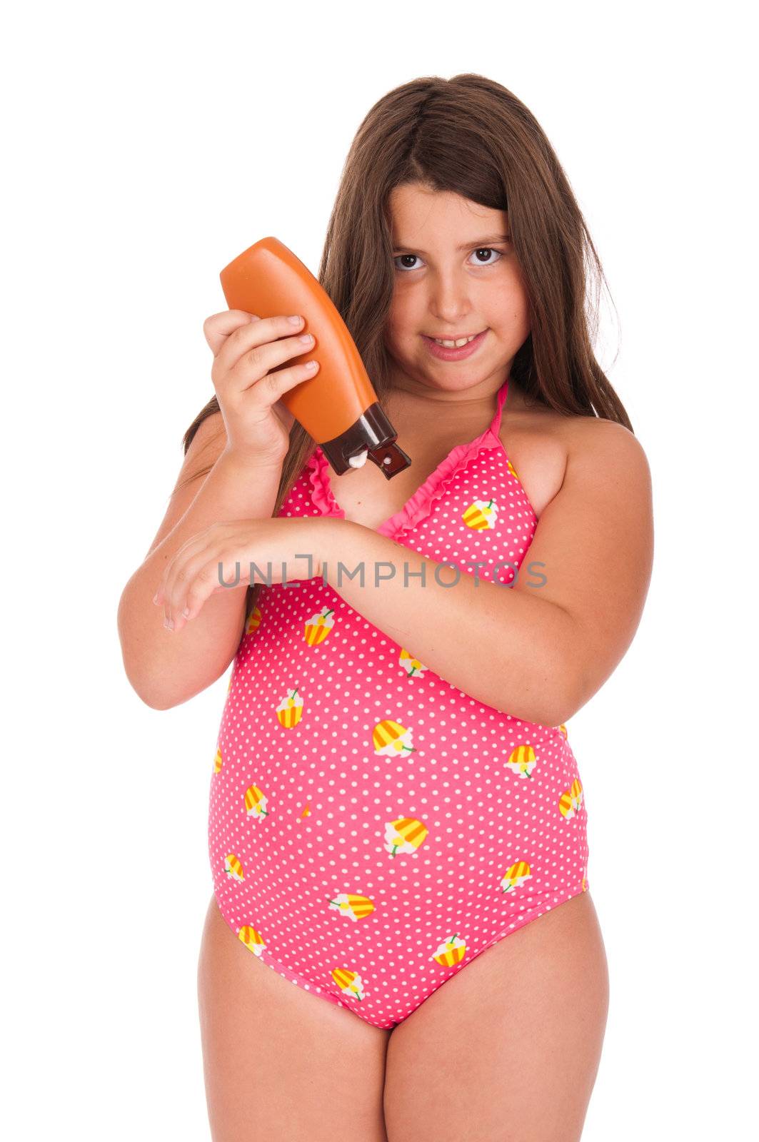 beautiful brunette teenage girl in swimsuit applying sun lotion (isolated on white background)