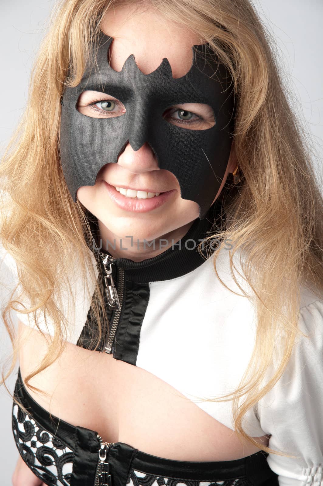 young and beautiful girl in the costume of a black bat