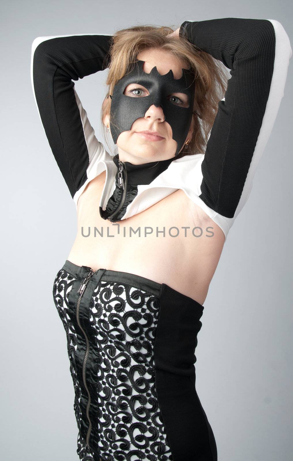 young and beautiful girl in the costume of a black bat