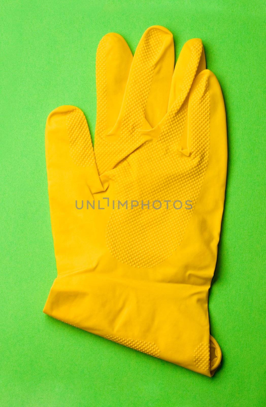 Glove isolated on green backgroun by Garsya