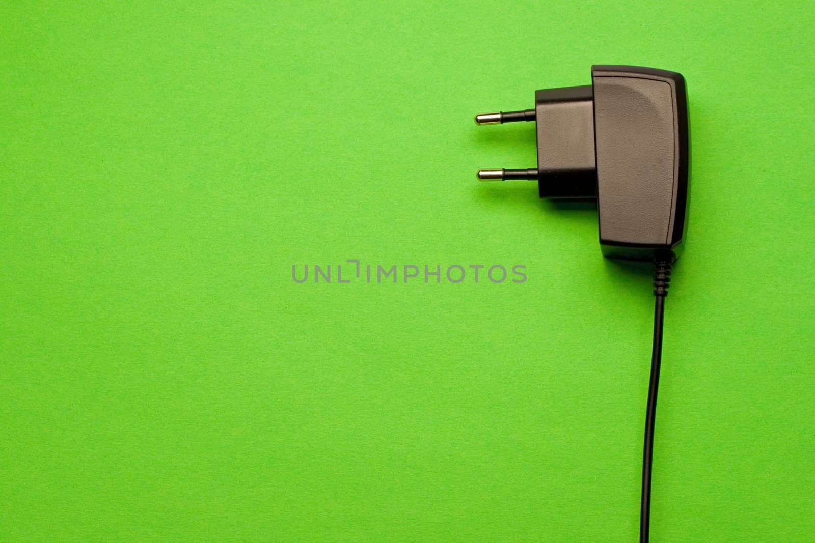 Electric plug isolated on the green background by Garsya