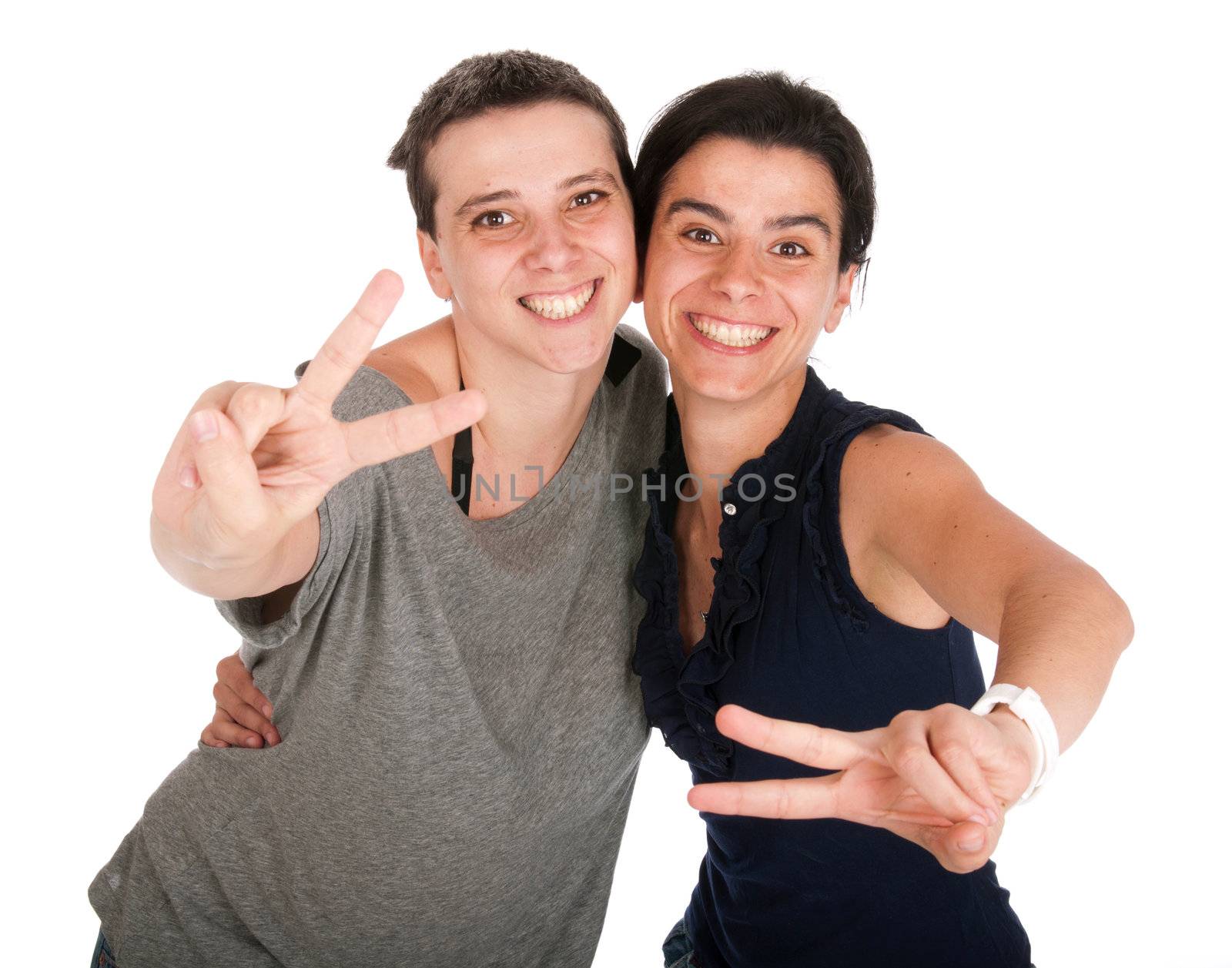 happy smiling sisters showing victory hand sign, isolated on white background