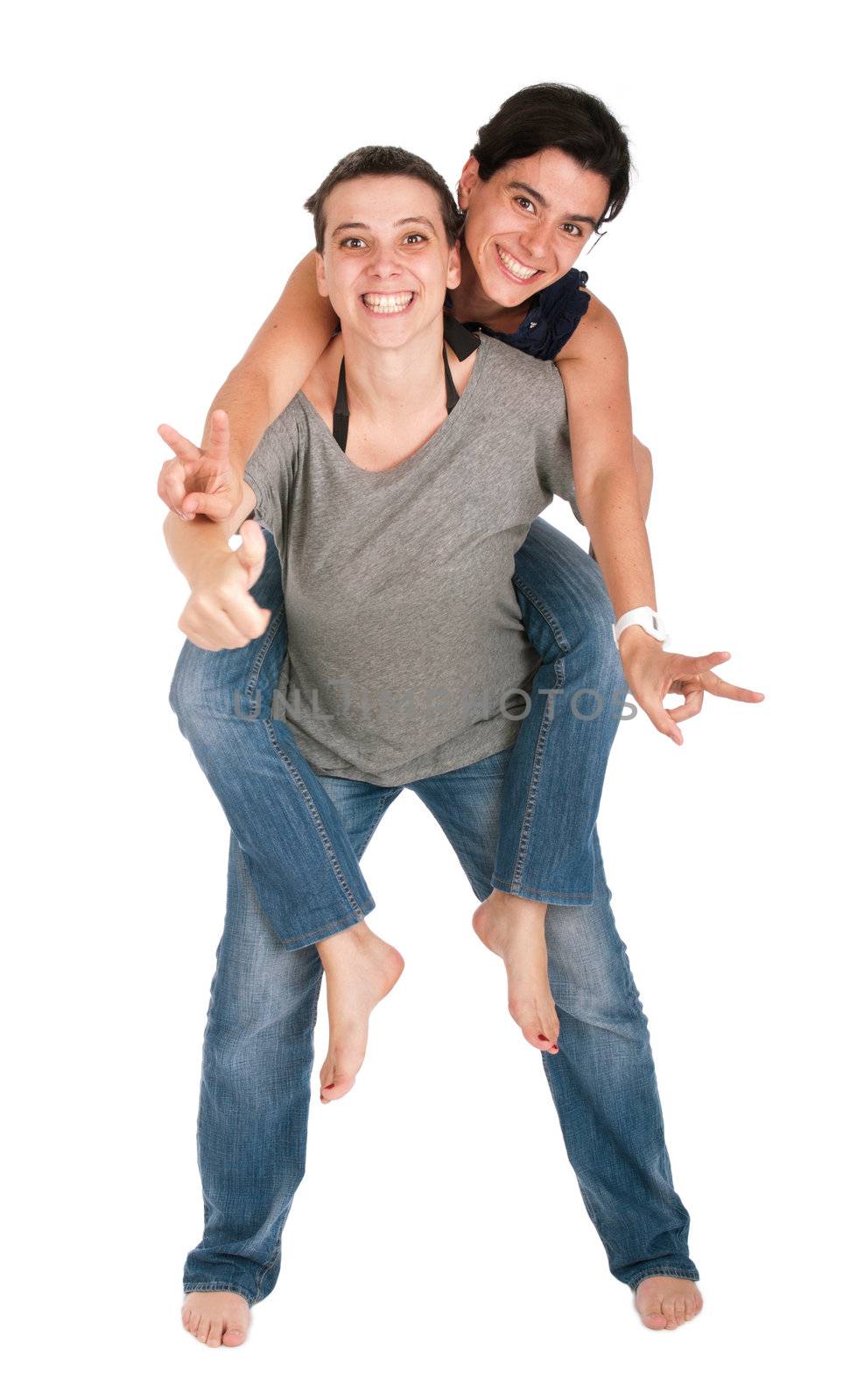 happy smiling sisters showing victory hand sign while playing together piggyback, isolated on white background