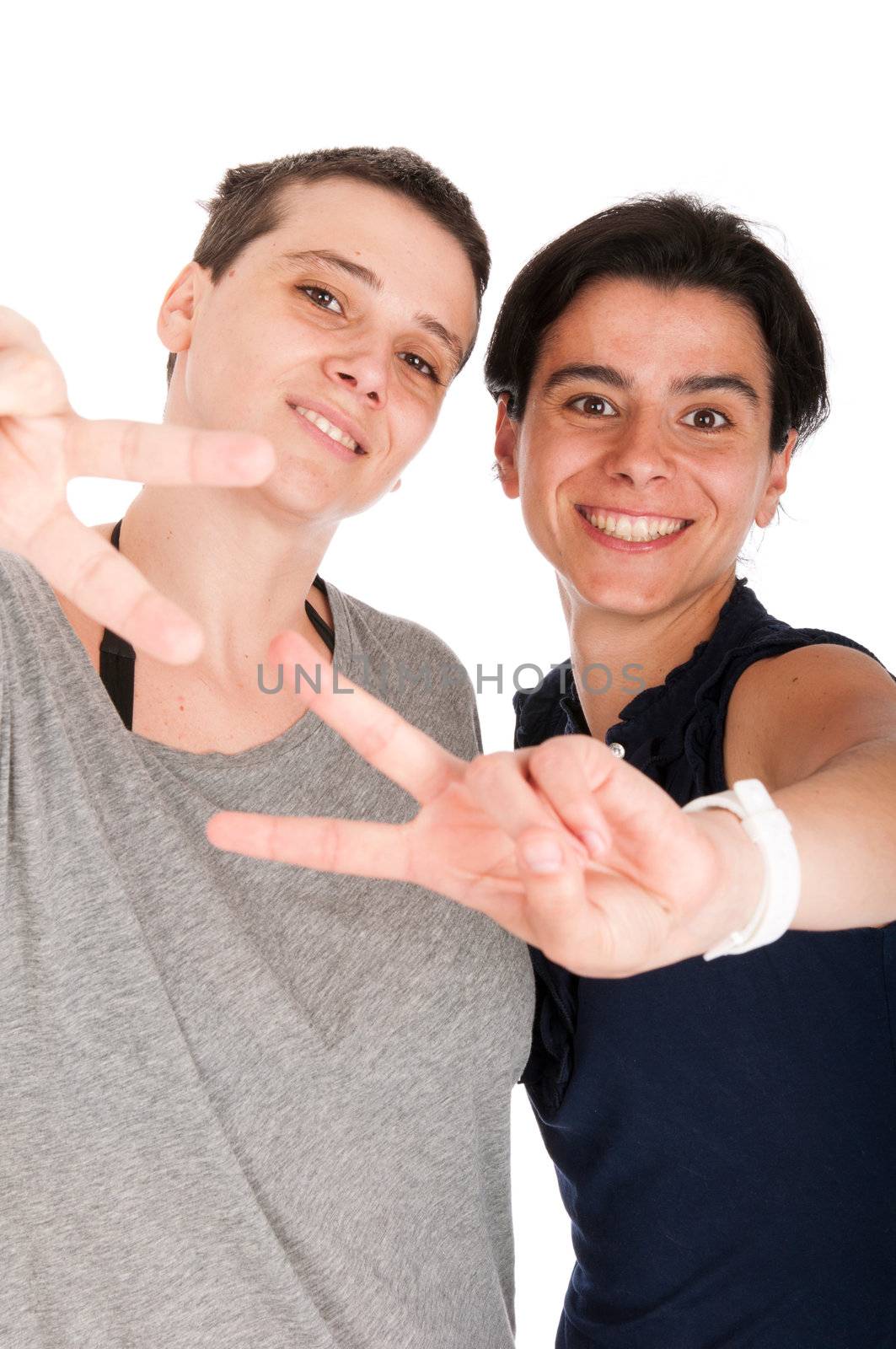 happy smiling sisters showing victory hand sign, isolated on white background