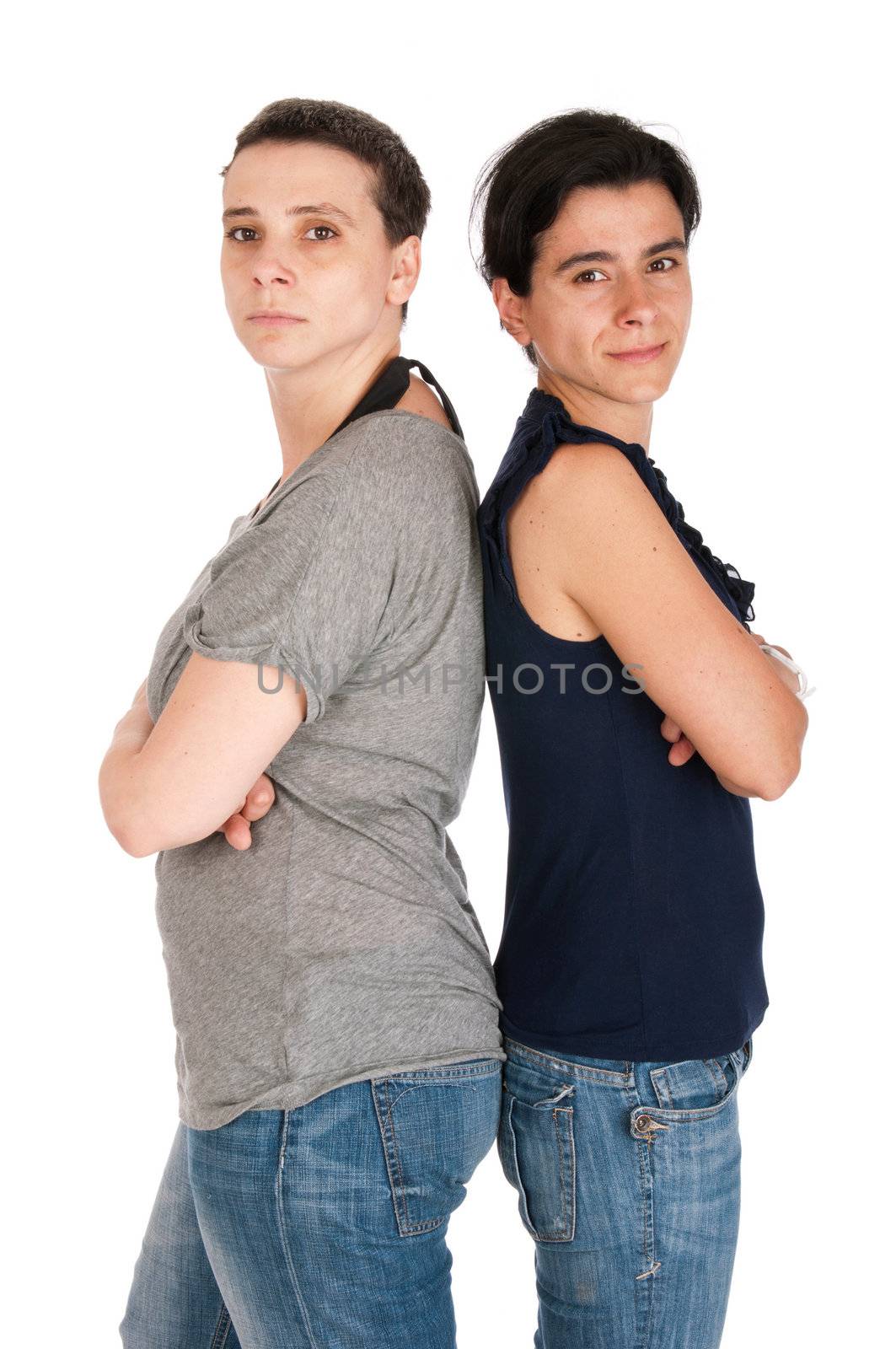 portrait of sisters who are upset with each other after a disagreement, isolated on white background