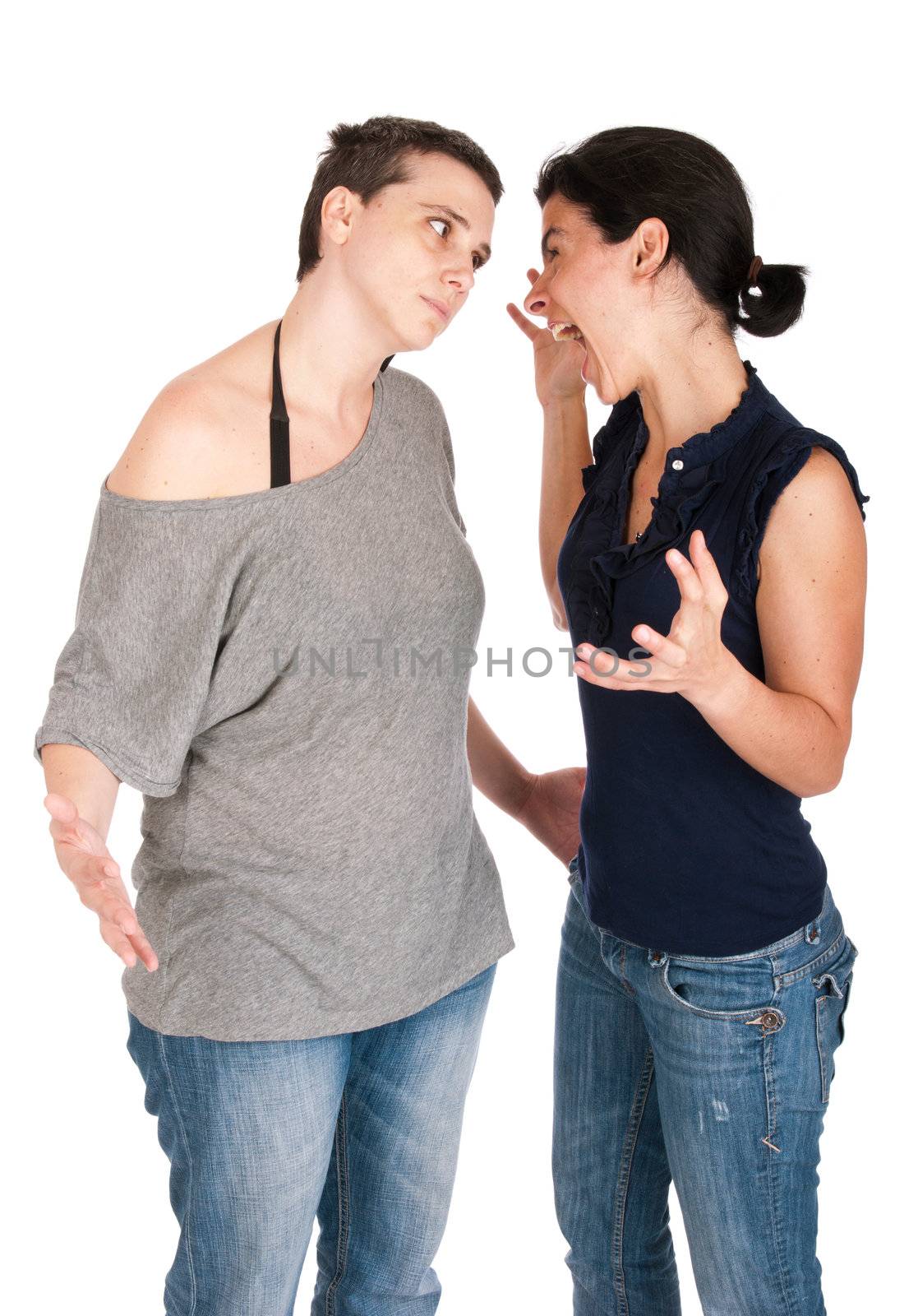 angry sisters in their 30s arguing and yelling with each other, isolated on white background