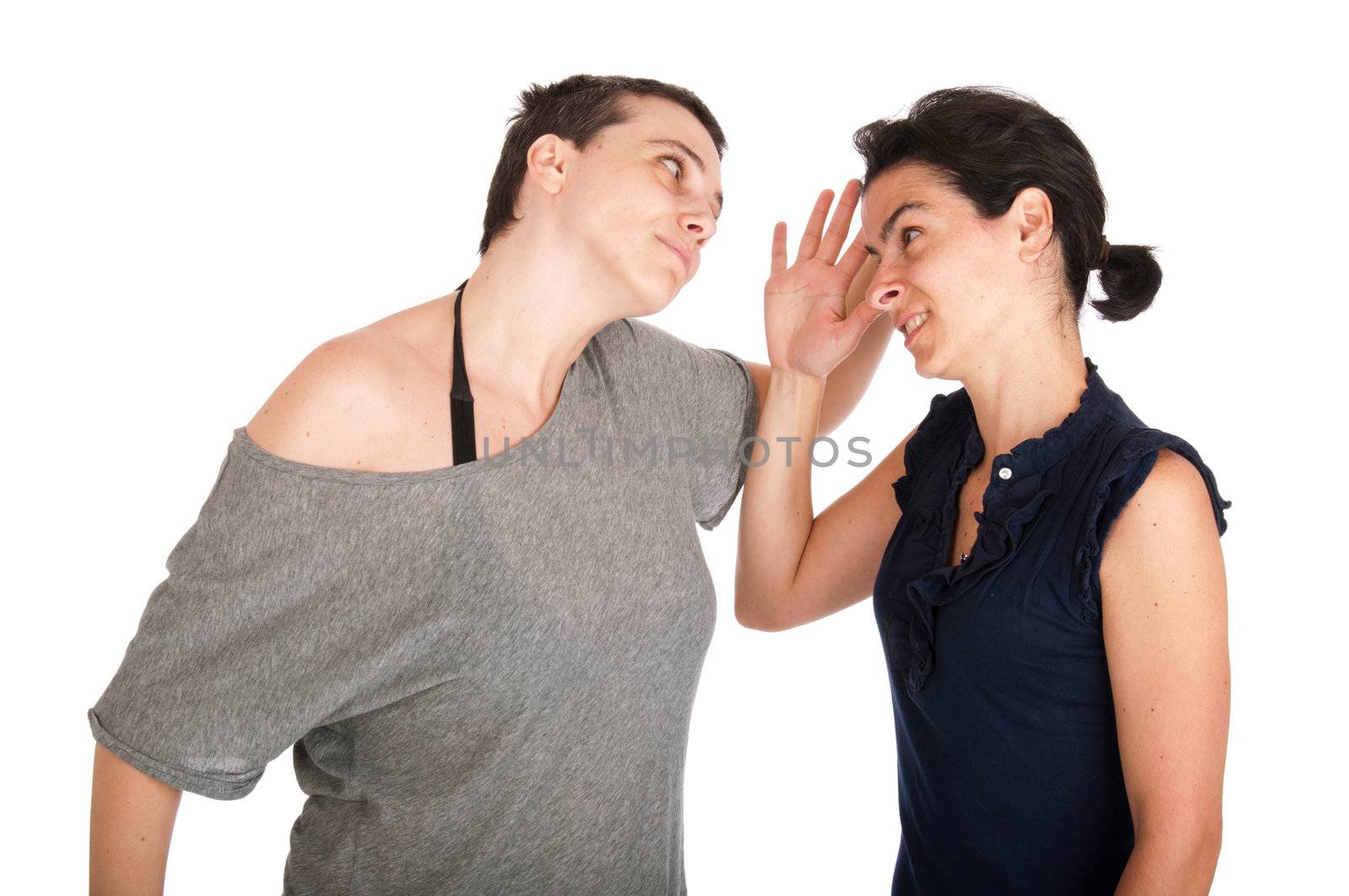 angry sisters in their 30s arguing with each other, isolated on white background