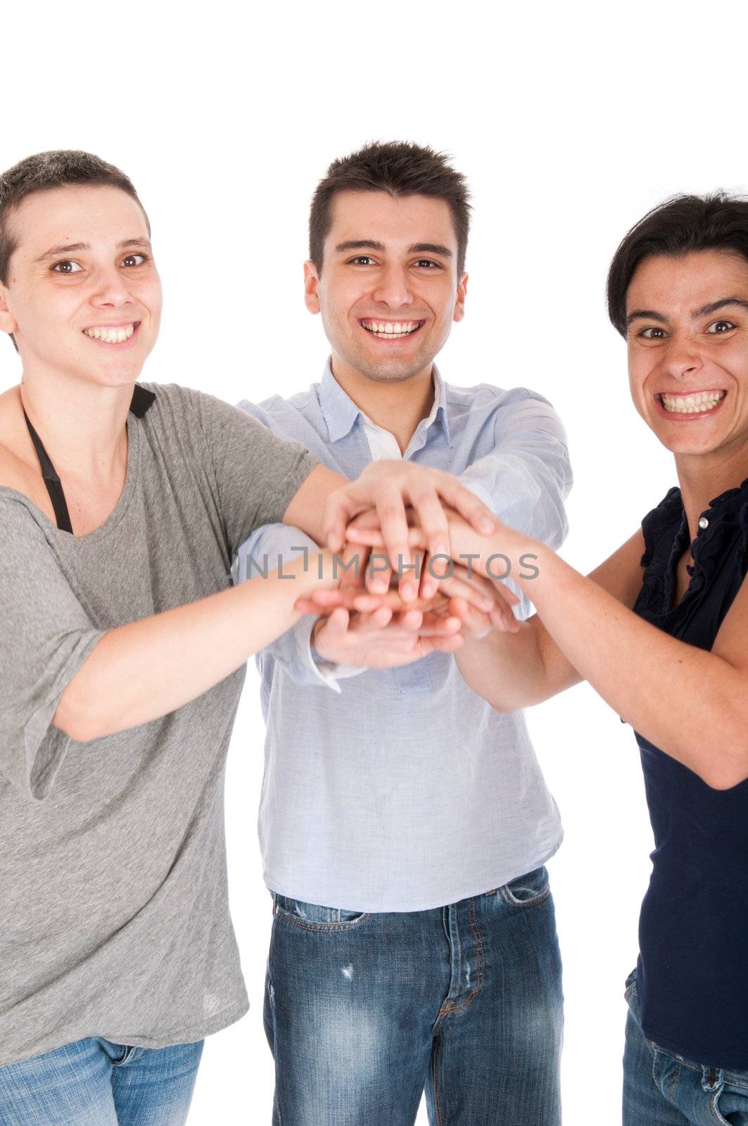 happy smiling brother and sisters putting their hands on top of each other celebrating their union or recent success (isolated on white background) focus on man