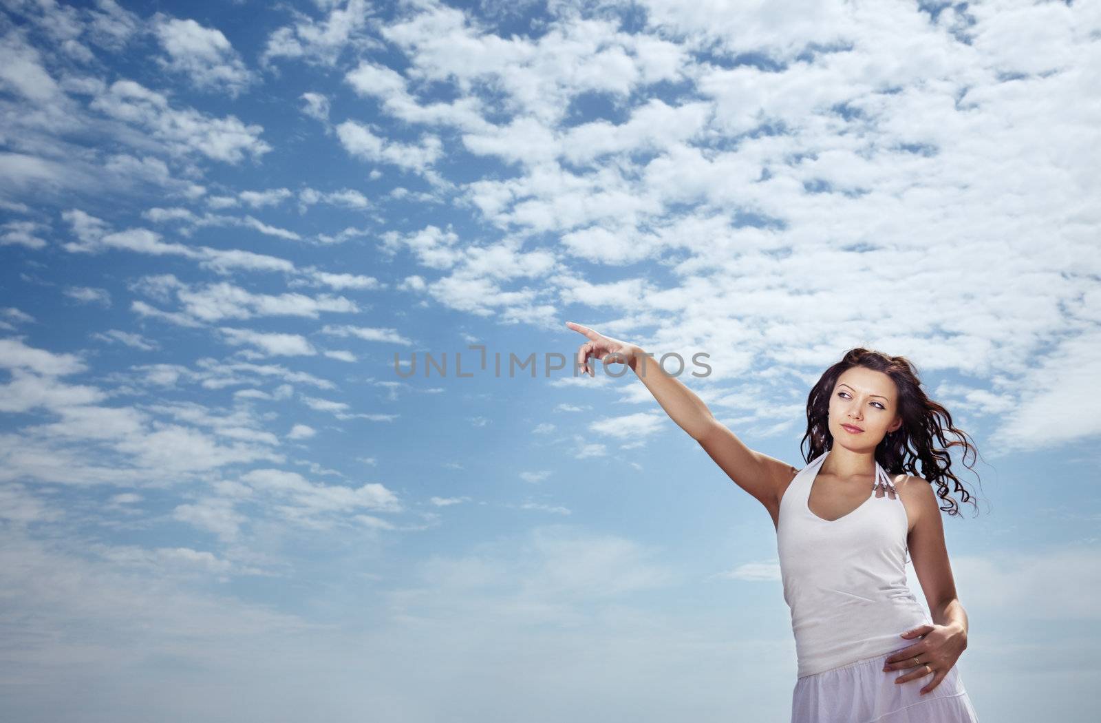 Lady pointing her finger at the sky