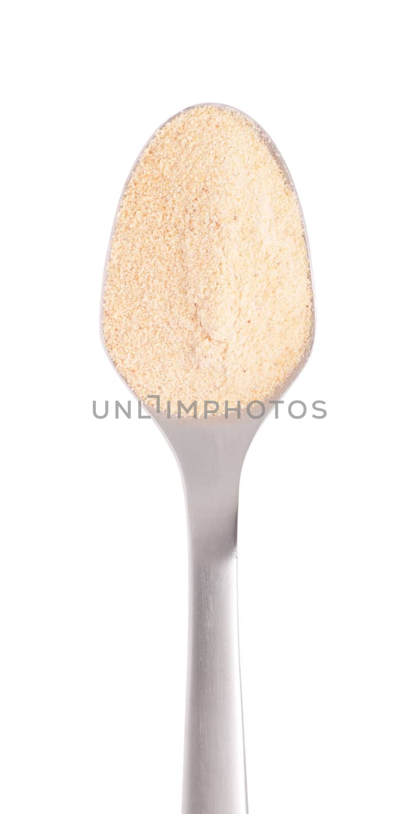 garlic spice on a stainless steel spoon, isolated on white background