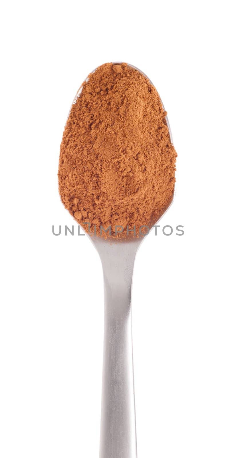 cinnamon spice on a stainless steel spoon, isolated on white background