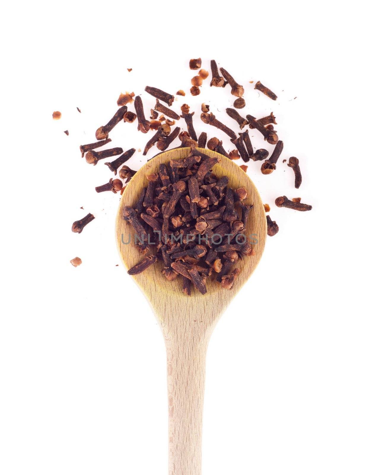 cloves spice on a wooden spoon, isolated on white background