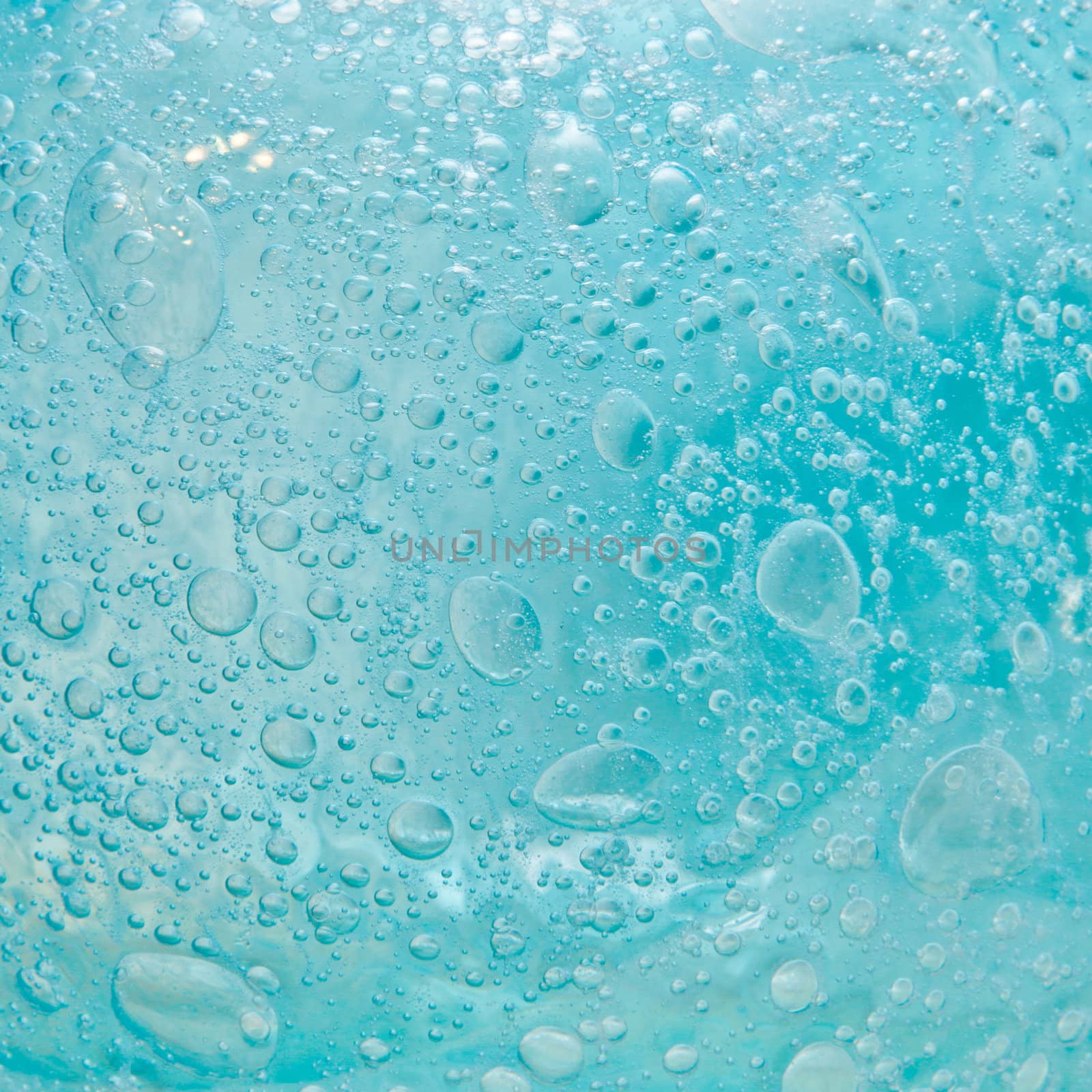 Blue bubbles in glass as a fresh background image