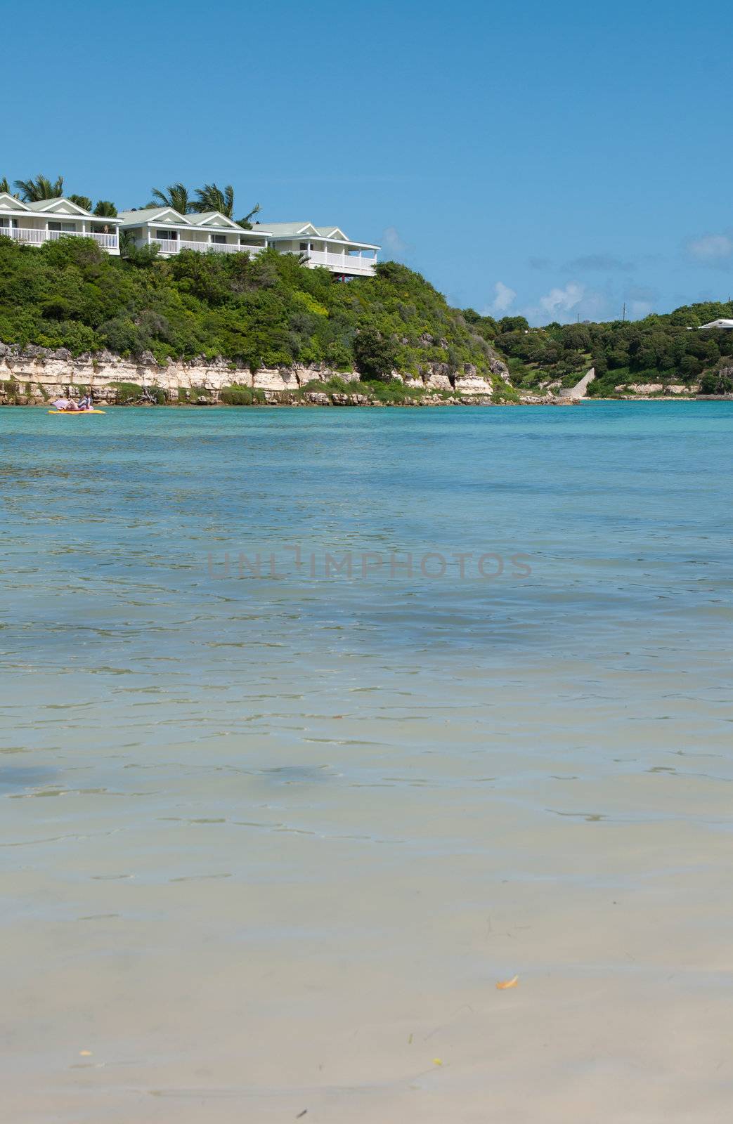 tropical beach and resort villas along the coast in Long Bay, Antigua