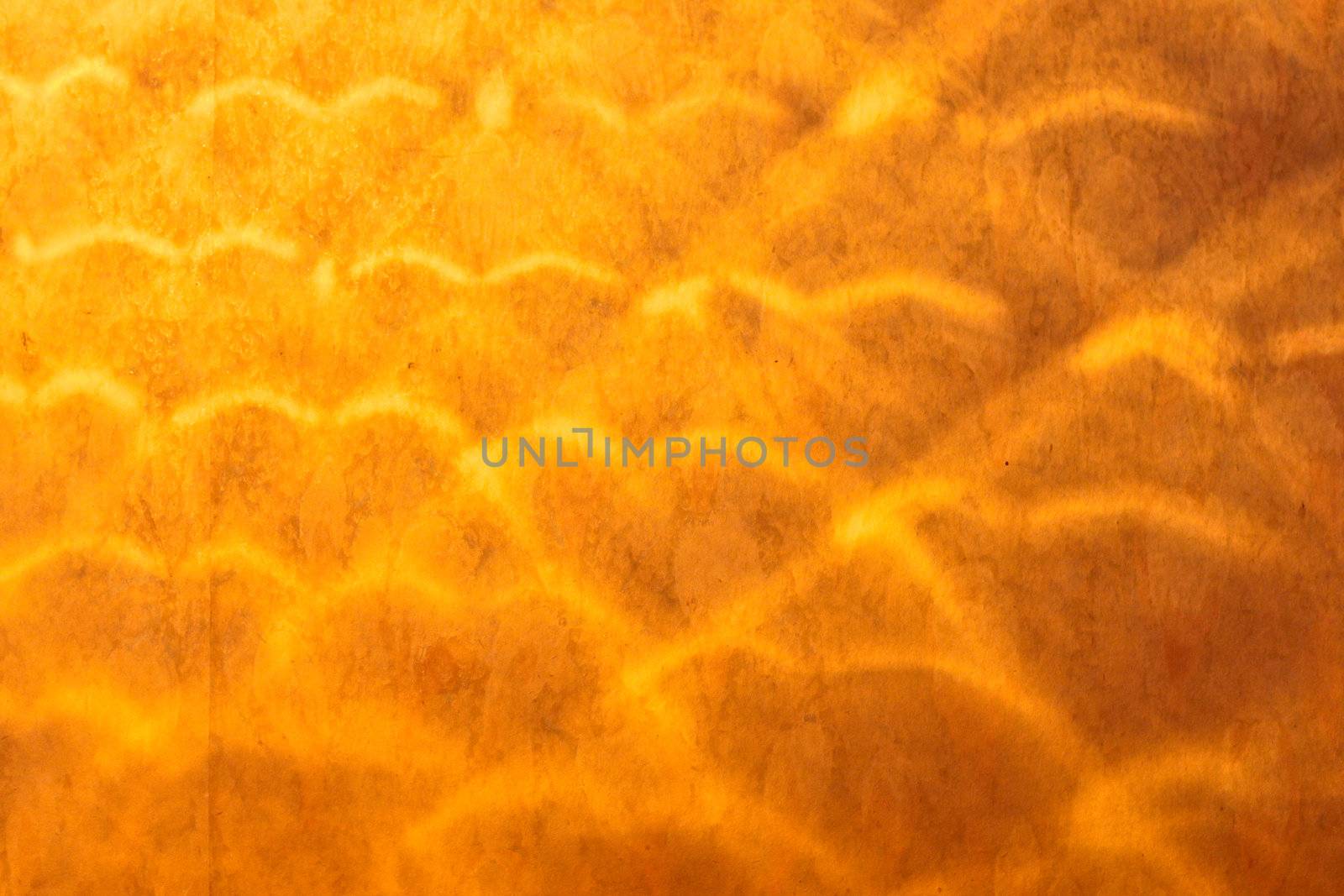Interesting pattern of light on old grungy wall paper