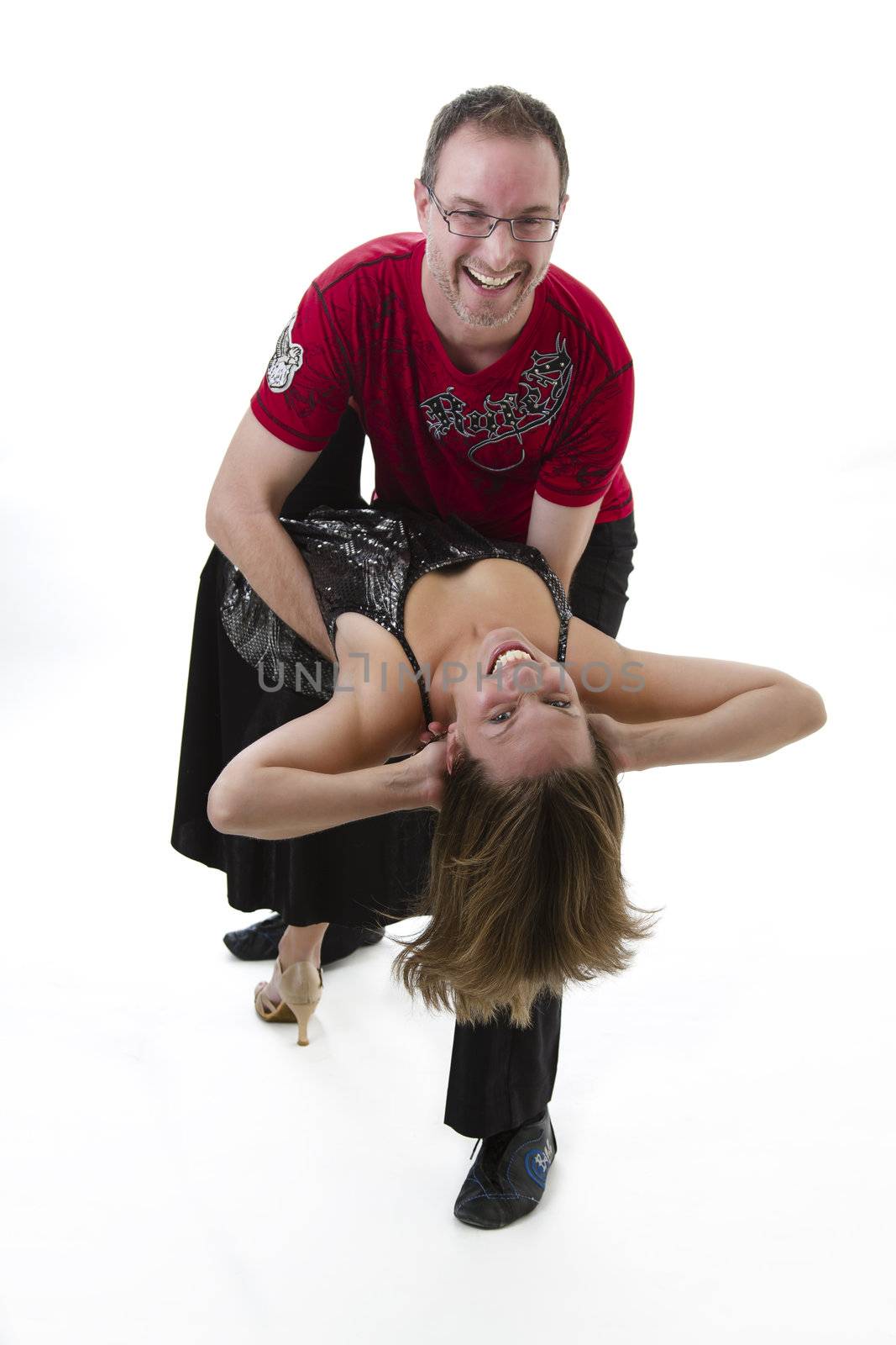 couple dancing salsa in the middle of a pose