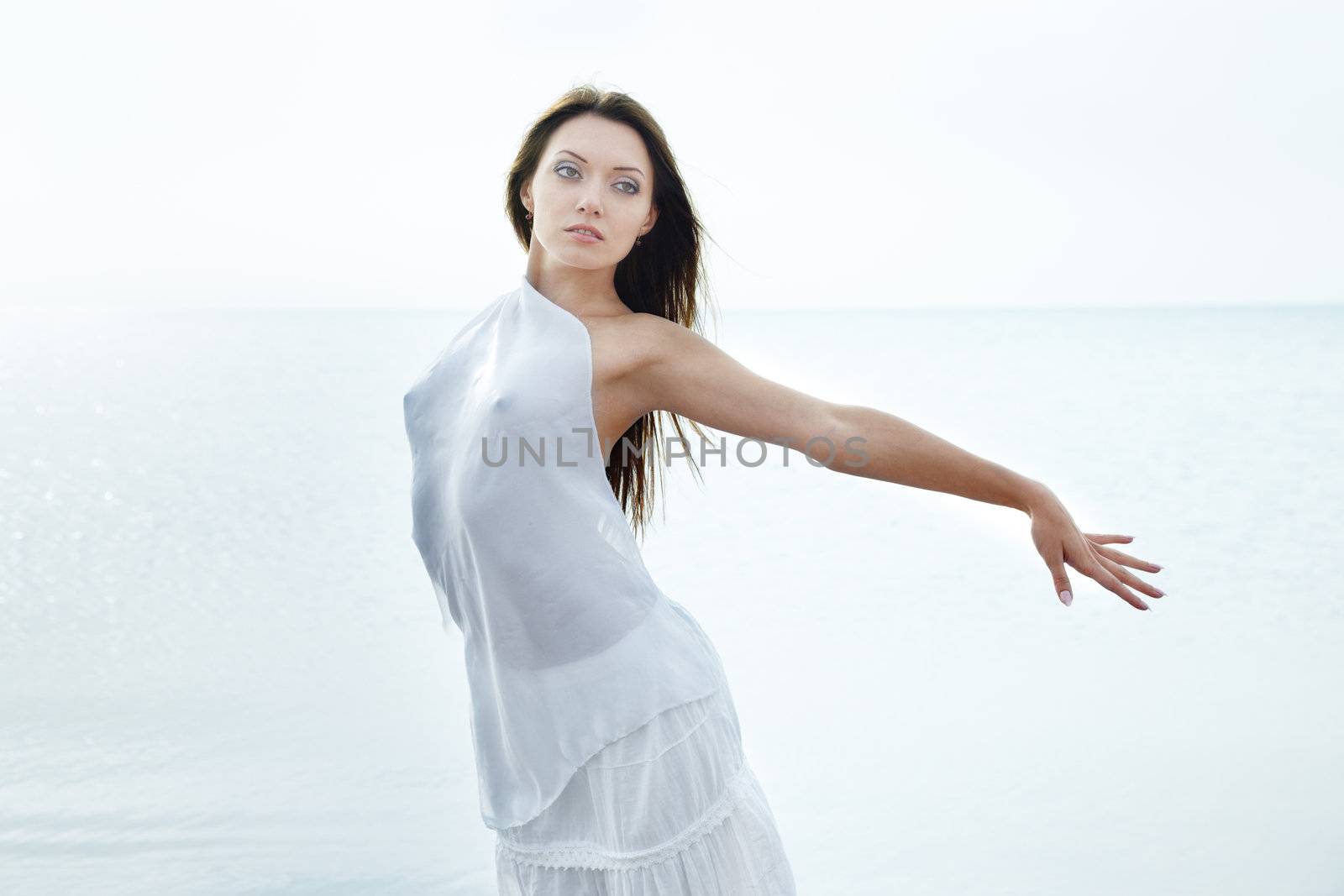 Perfect lady outdoors posing against the sea background