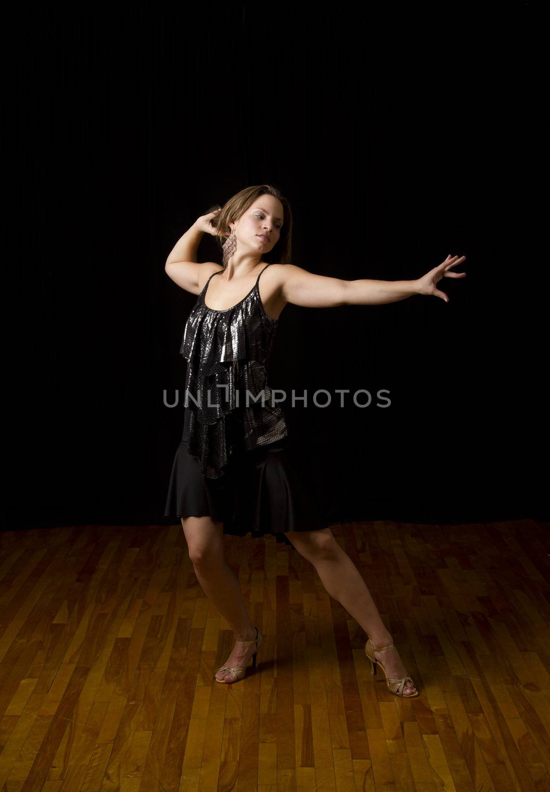 Young dancer in the middle of a pose