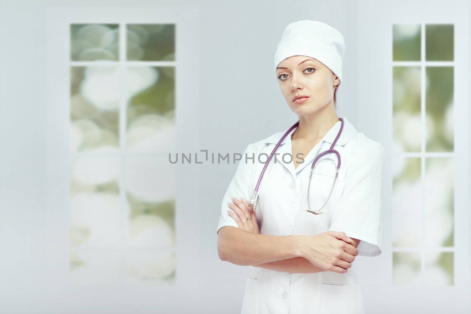 Doctor with stethoscope standing indoors in the clinic