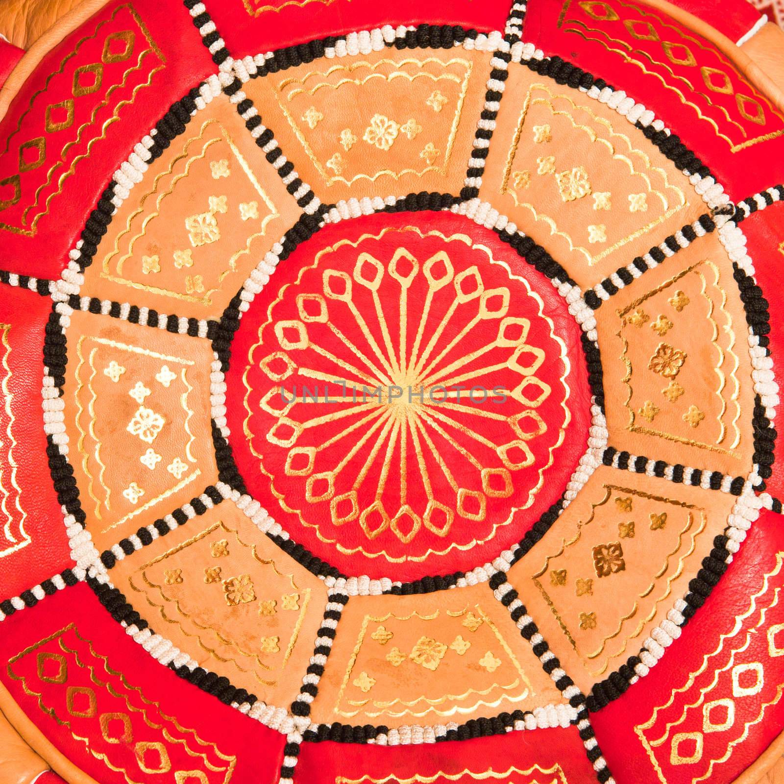 Close up of the design of a Moroccan leather cushion