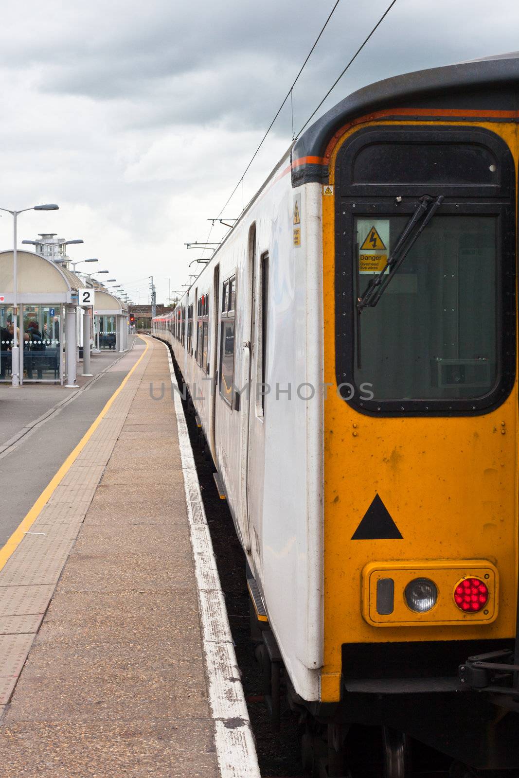 A long commuter train parked at Cambridge railway station, UK