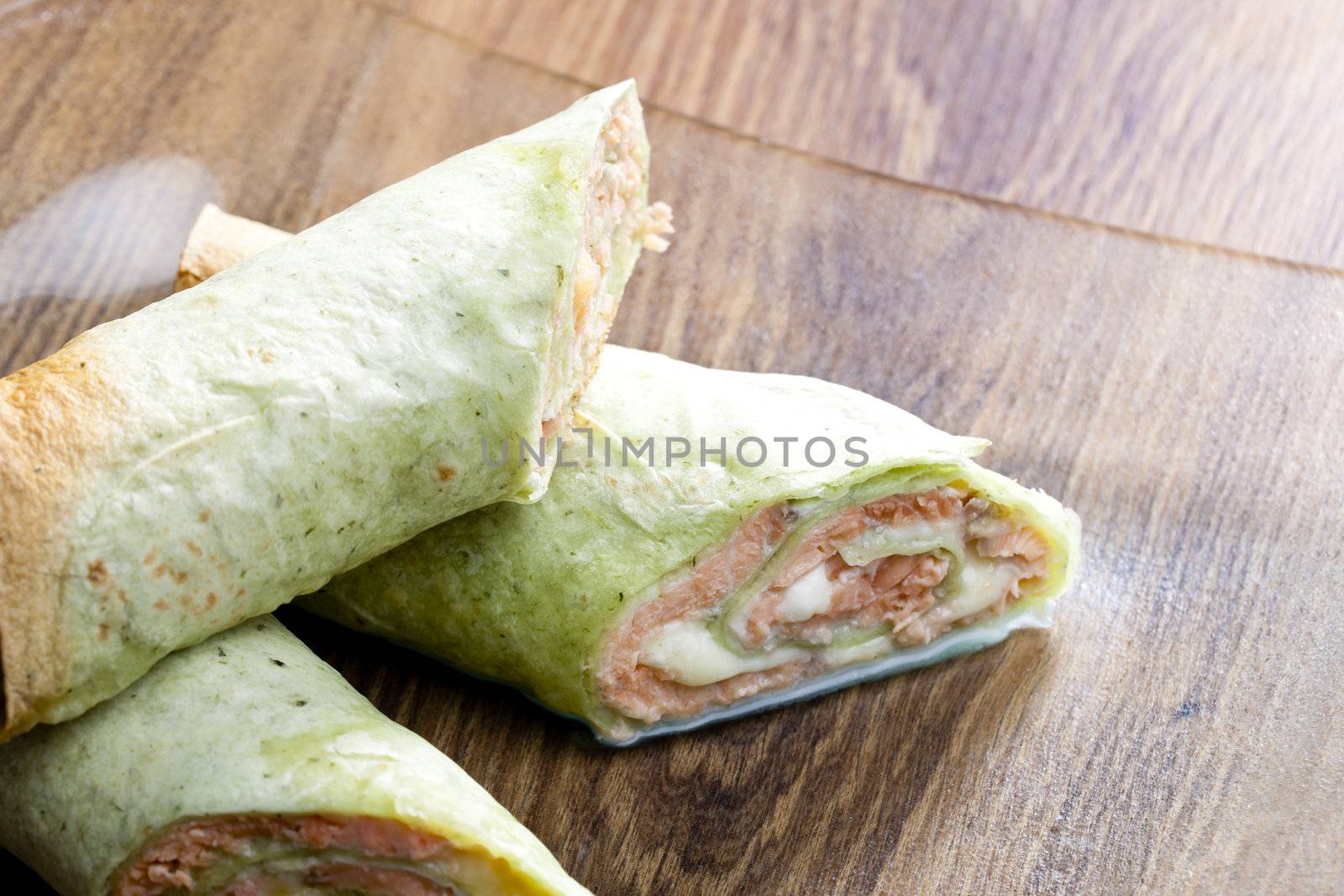 spinach tortilla filled with salmon and mozzarella