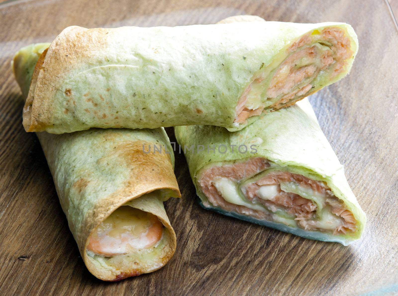 spinach tortilla filled with salmon and mozzarella