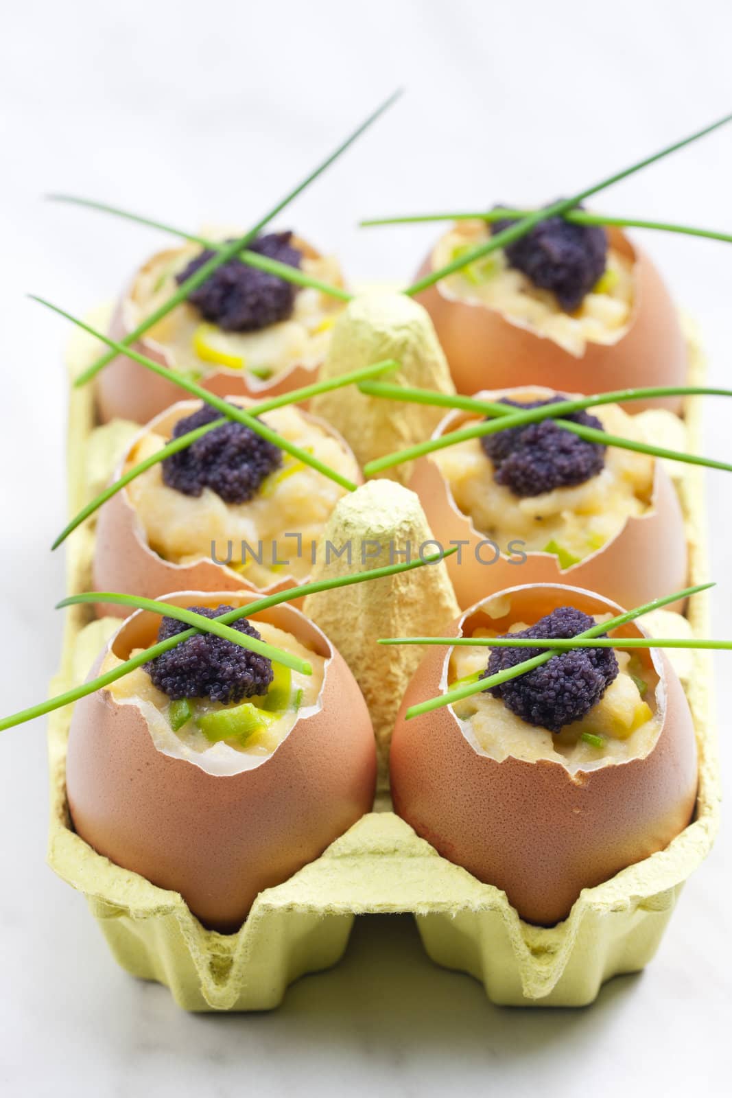 scrambled eggs with chives and black caviar